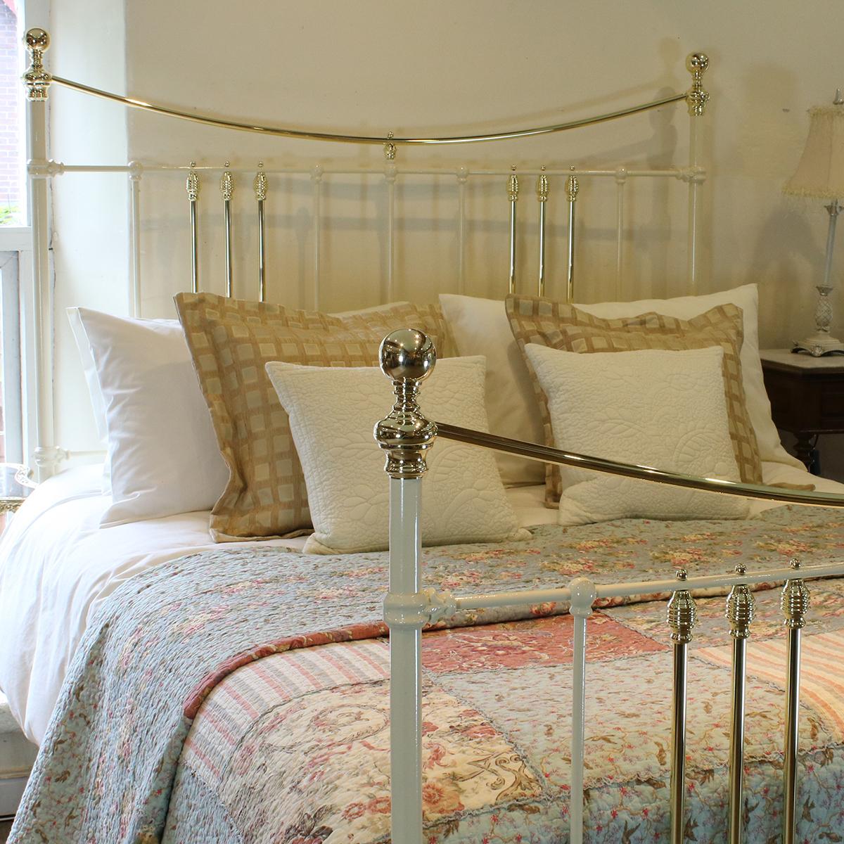 Antique bed in cream with curved brass top rail. 

This bed accepts a UK King size or US Queen size (5ft, 60in or 150cm wide) base and mattress set.

The price is for the bed frames alone. The bases, mattresses, bedding and bed linen are extra.
