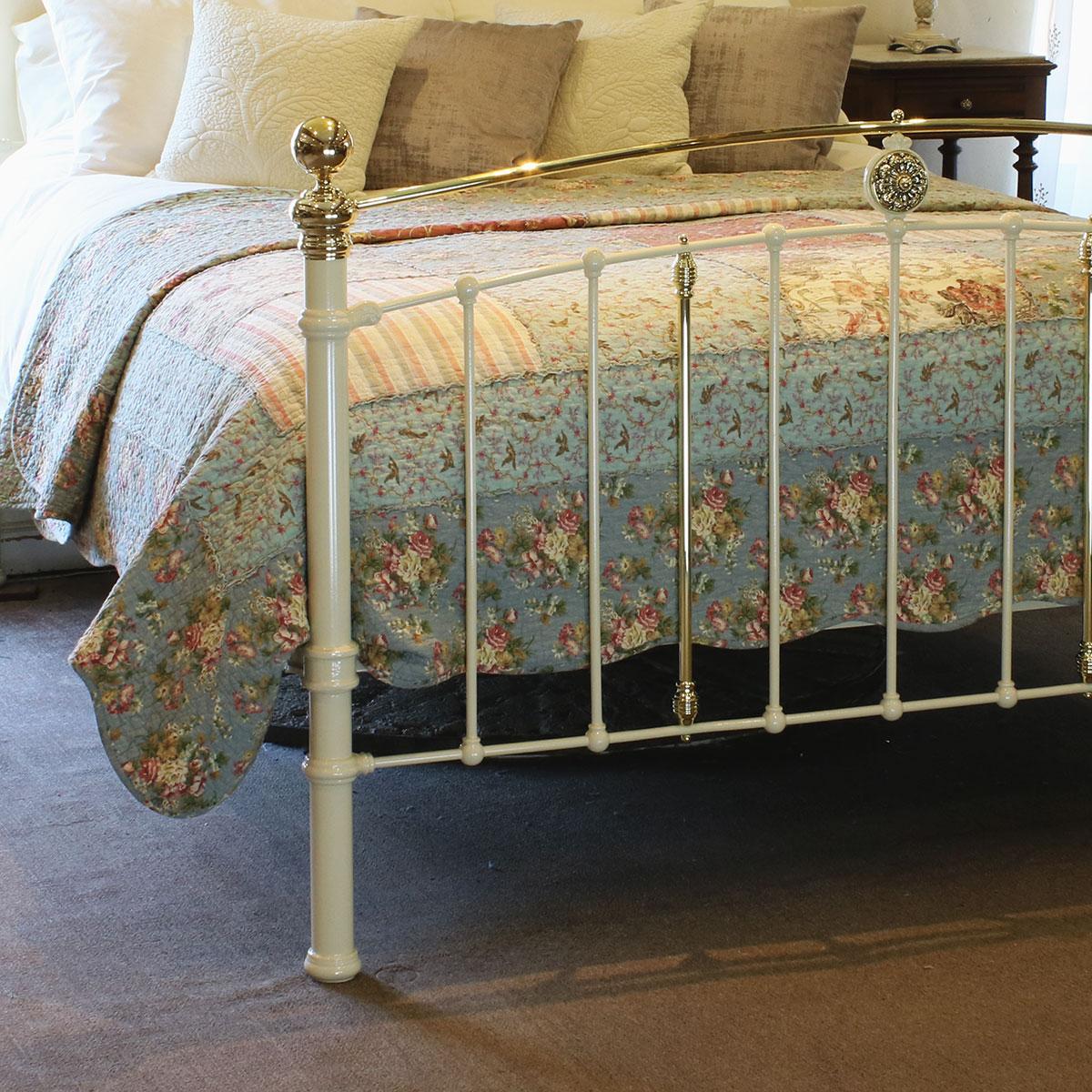 Antique bed in cream with convex brass top rail, decorative central brass castings and brass kneecaps.

This bed accepts a UK King size or US Queen size (5ft, 60in or 150cm wide) base and mattress set.

The price includes a standard firm bed base to