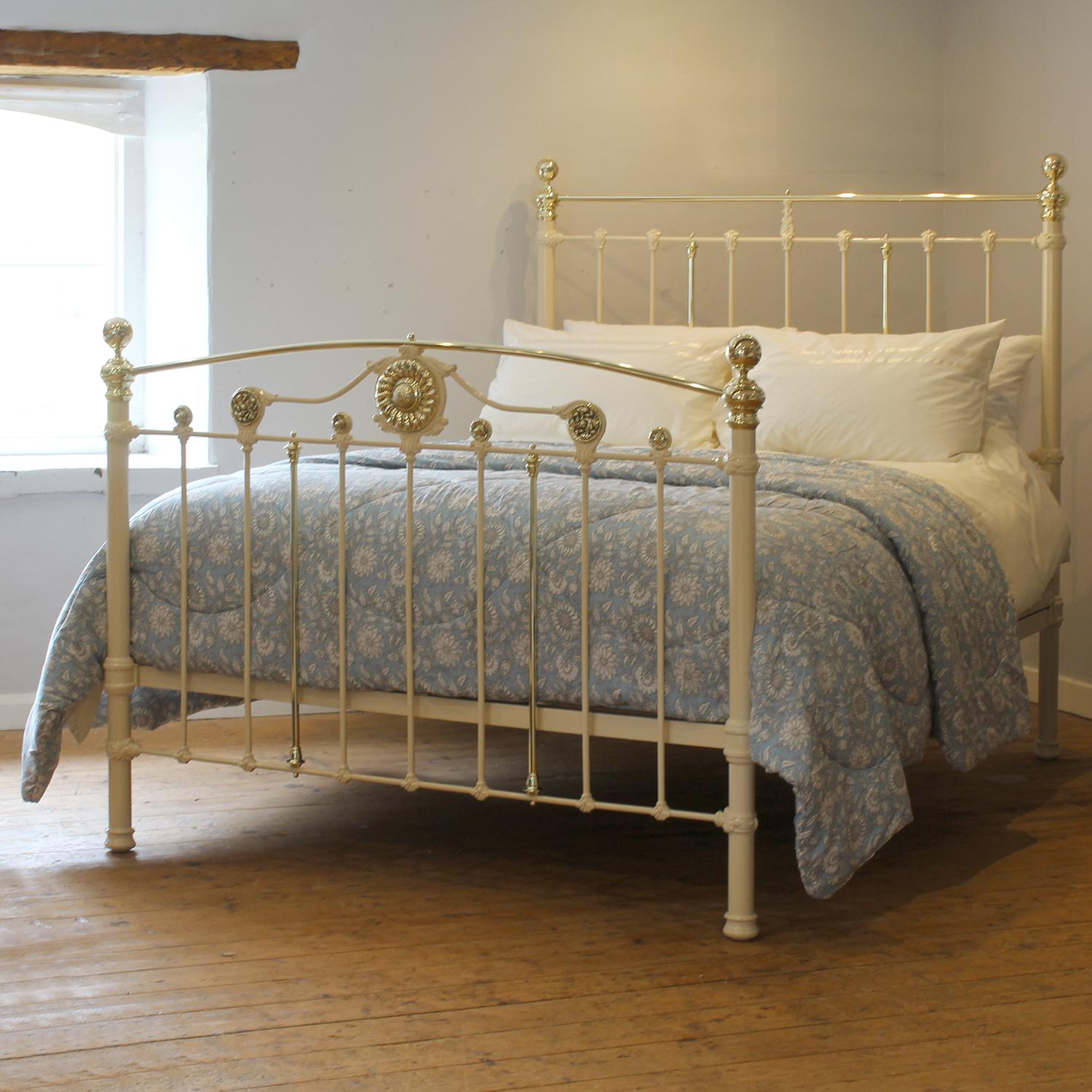 A superb cast iron antique bed finished in cream with decorative footboard displaying floral rosettes including a stunning central rossette of a sunflower..

This bed accepts a UK king size or US queen size (5ft, 60in or 150cm wide) base and