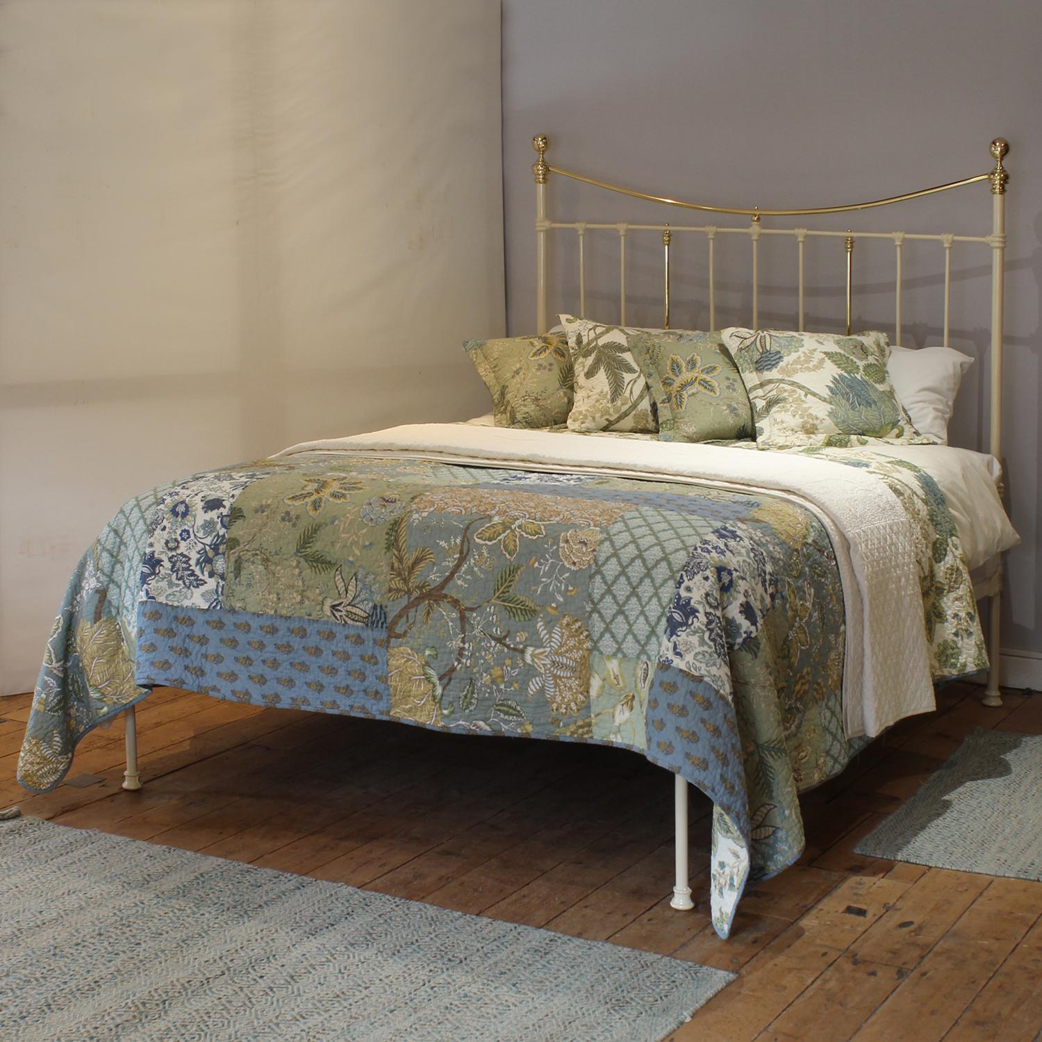 An attractive cast iron Victorian antique platform bed with low foot end, finished in cream with brass decoration.

This bed accepts a UK king size or US queen size (5ft, 60in or 150cm wide) base and mattress set.

The price includes a standard firm