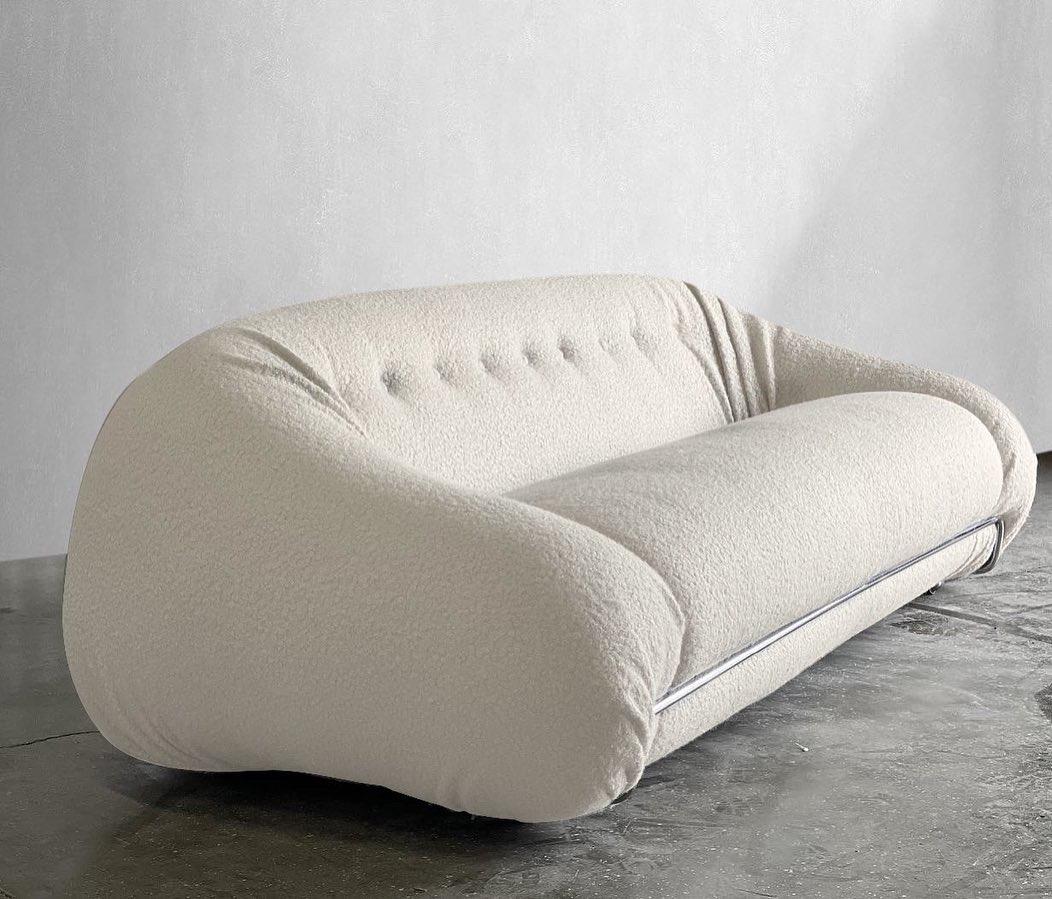 Cream boucle sofa in the manner of Tobia Scarpa Soriana. 

This sofa is low and comfy - it’s like sitting on a cloud. Once you sit down you won’t want to get up! Fully restored with new high quality foam and freshly upholstered Boucle.

We love