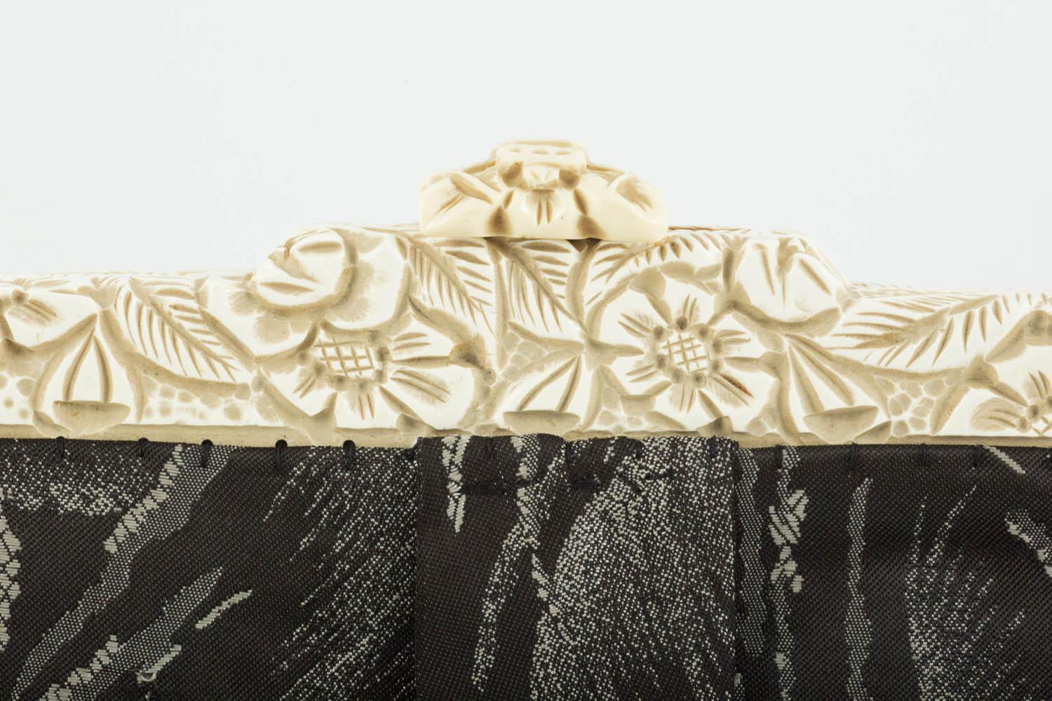 Black Cream carved Bakelite frame and patterned silk clutch bag, English, 1920s For Sale
