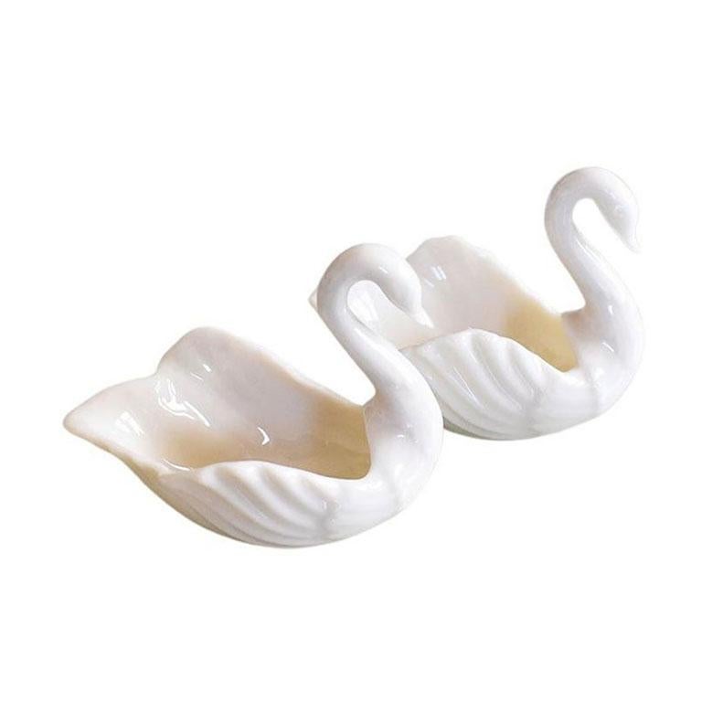 A set of porcelain swan salt wells by Lenox. 

Dimensions:
2.5