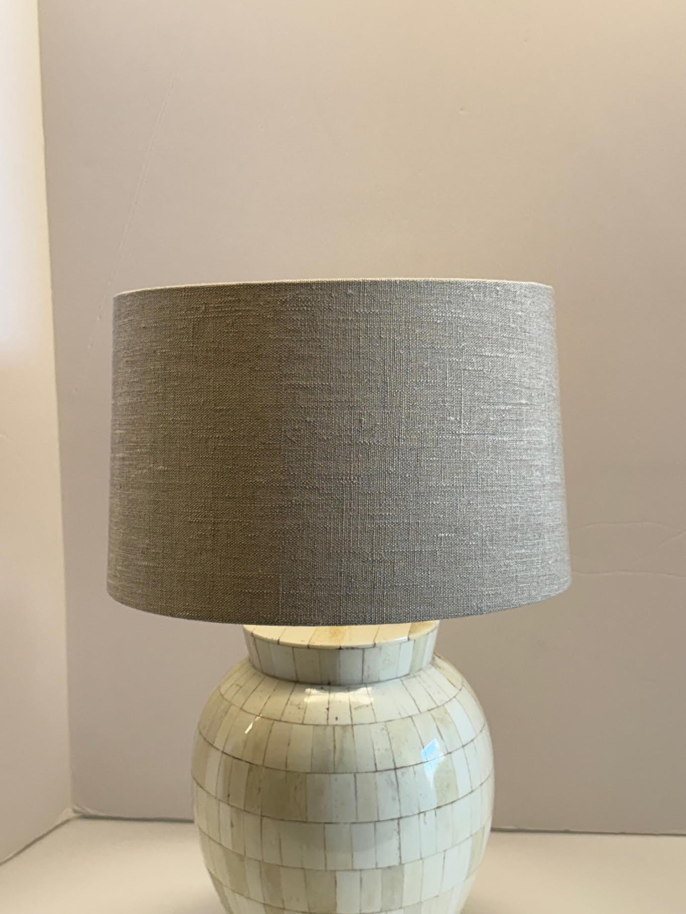 Contemporary Indonesian pair of rectangular shaped bone pieces shaped lamps.
Belgian linen shades.
Shade diameter 12