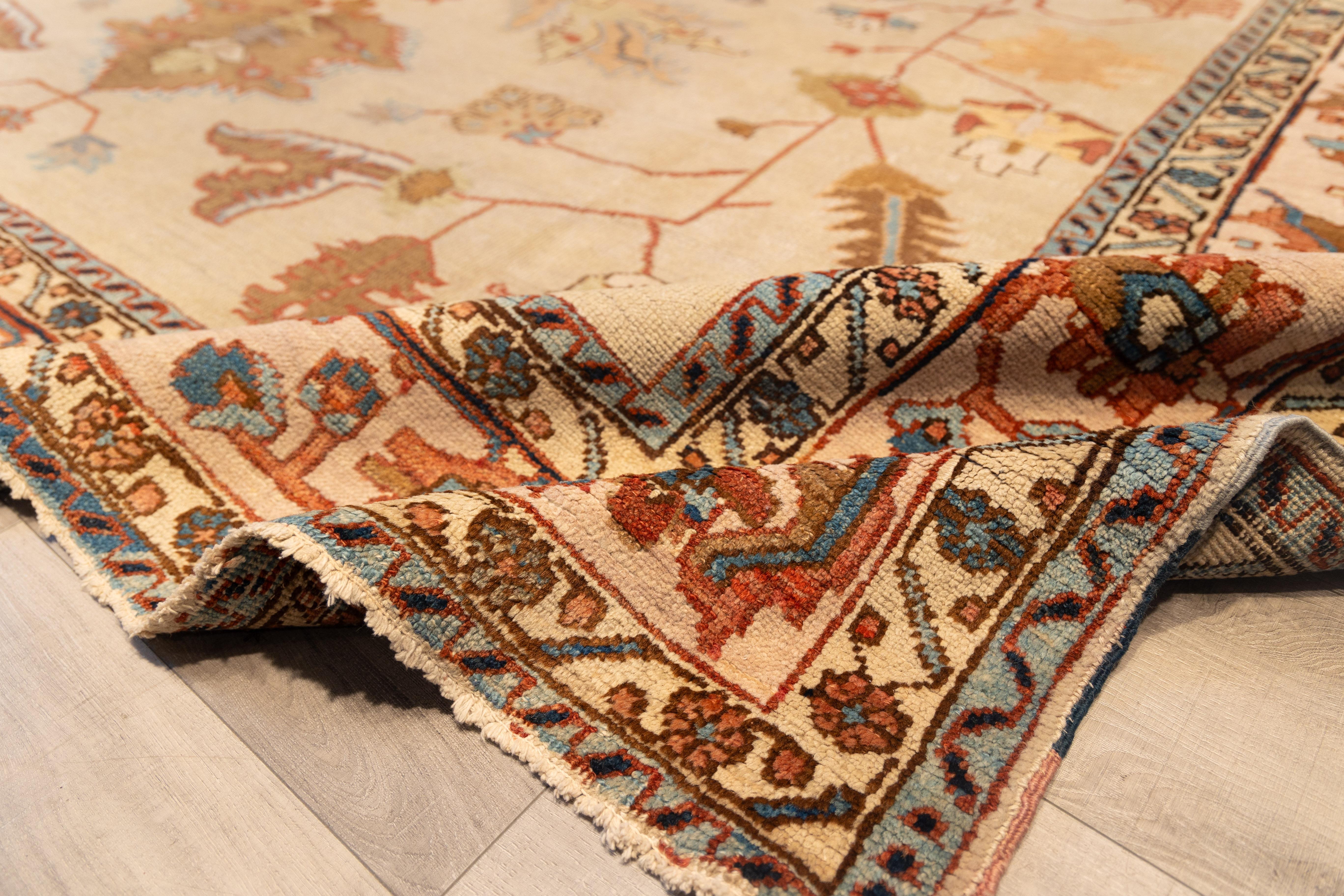 Heriz Serapi Antique cream field early 20th century north persian rug For Sale