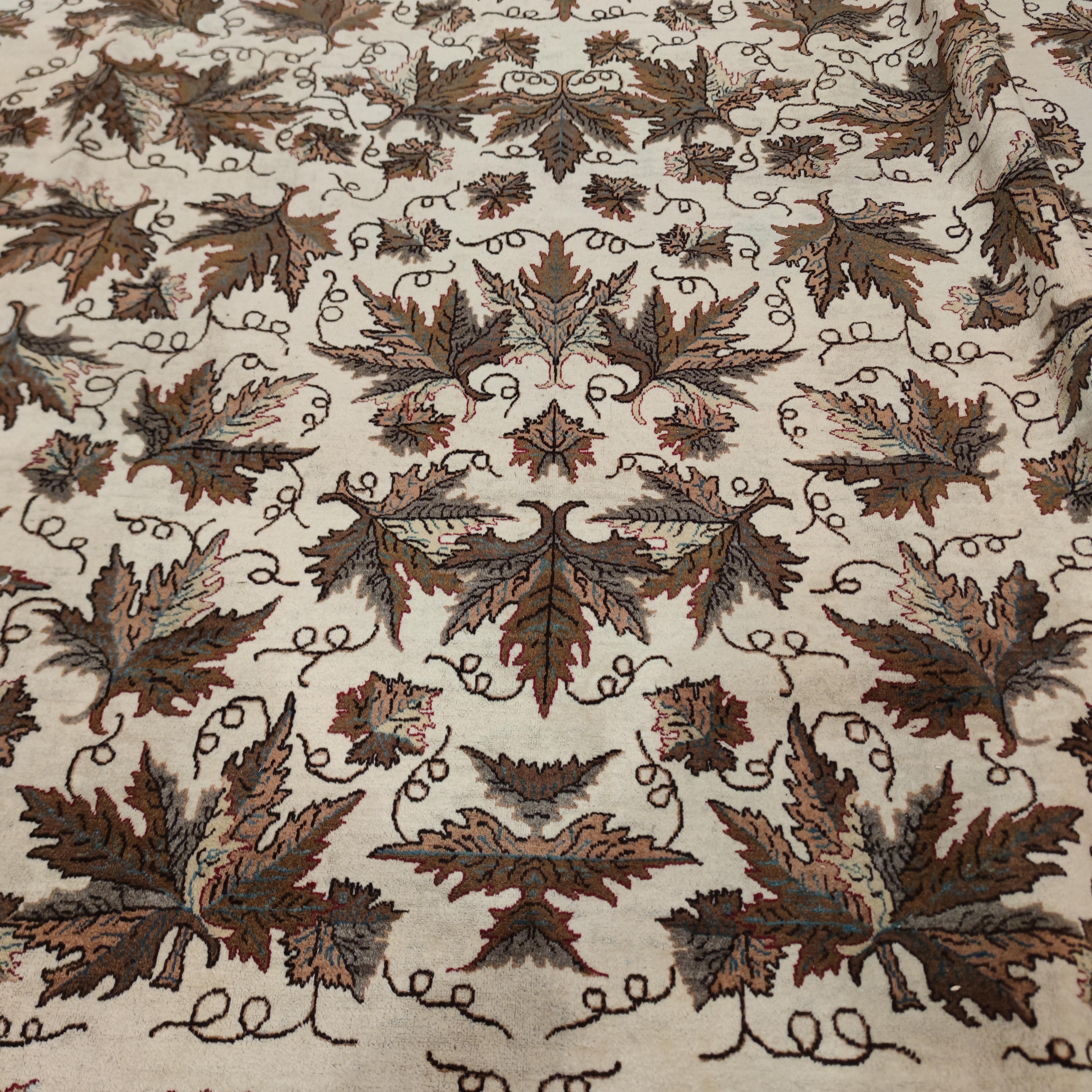 A highly unusual Modernist rug distinguished by a repeat pattern of realistically drawn, large oak leafs arranged on an ivory background. Finely knotted for this type, it is quite subdued with its neutral palette of naturally contrasting leafs. A