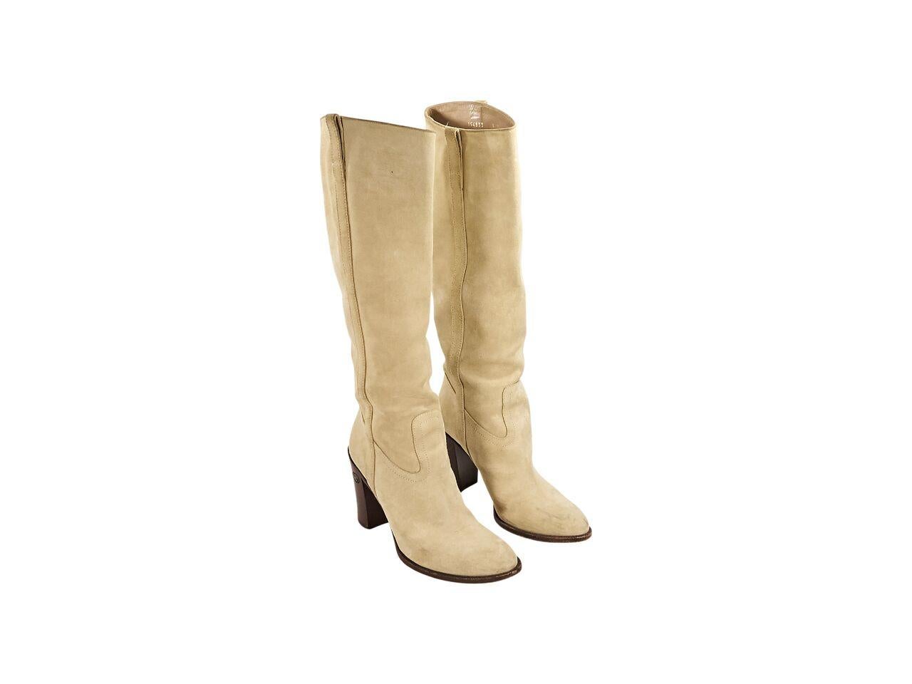 Product details:  Cream suede knee-high boots by Gucci.  Stacked block heel.  Pull-on style.  4