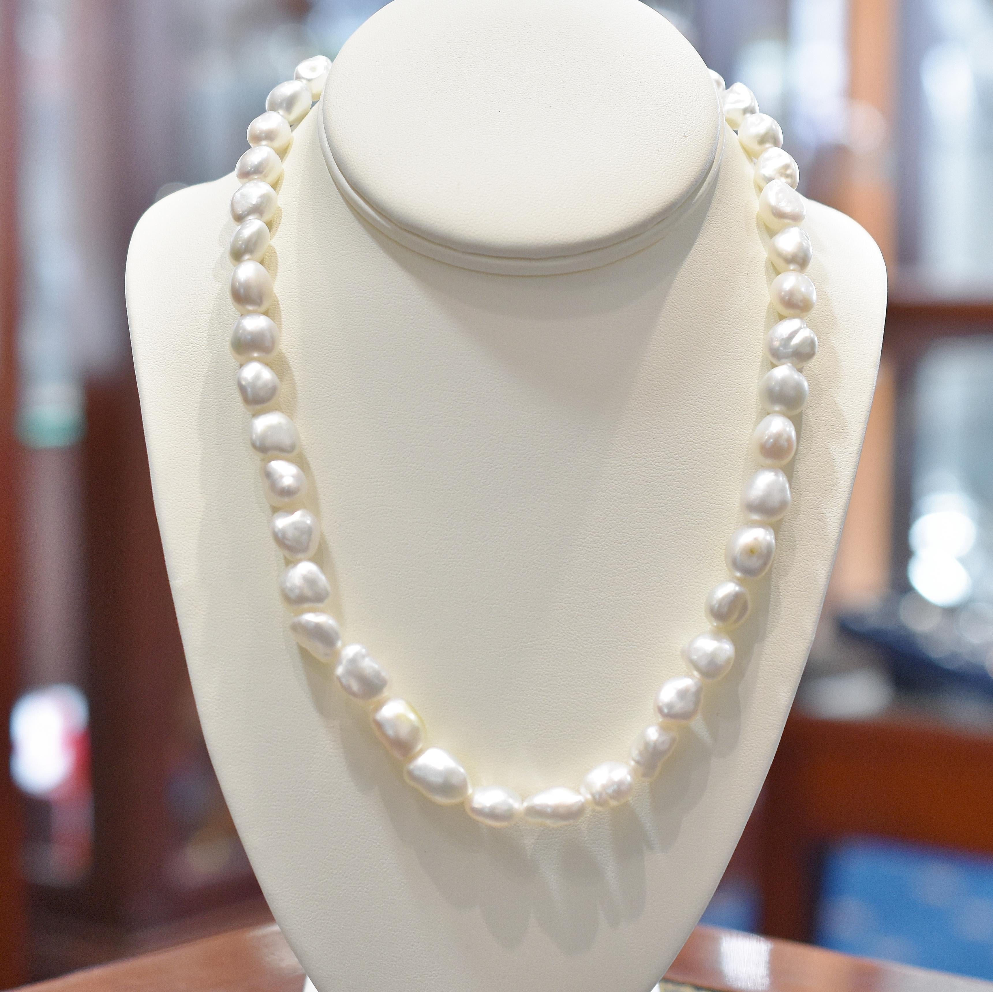 Keshi pearl creamy white necklace on a 10mm sterling silver fluted ball box clasp. There are 42 pearls from 9.0mm to 11.0mm 
The strand is 45cm in length