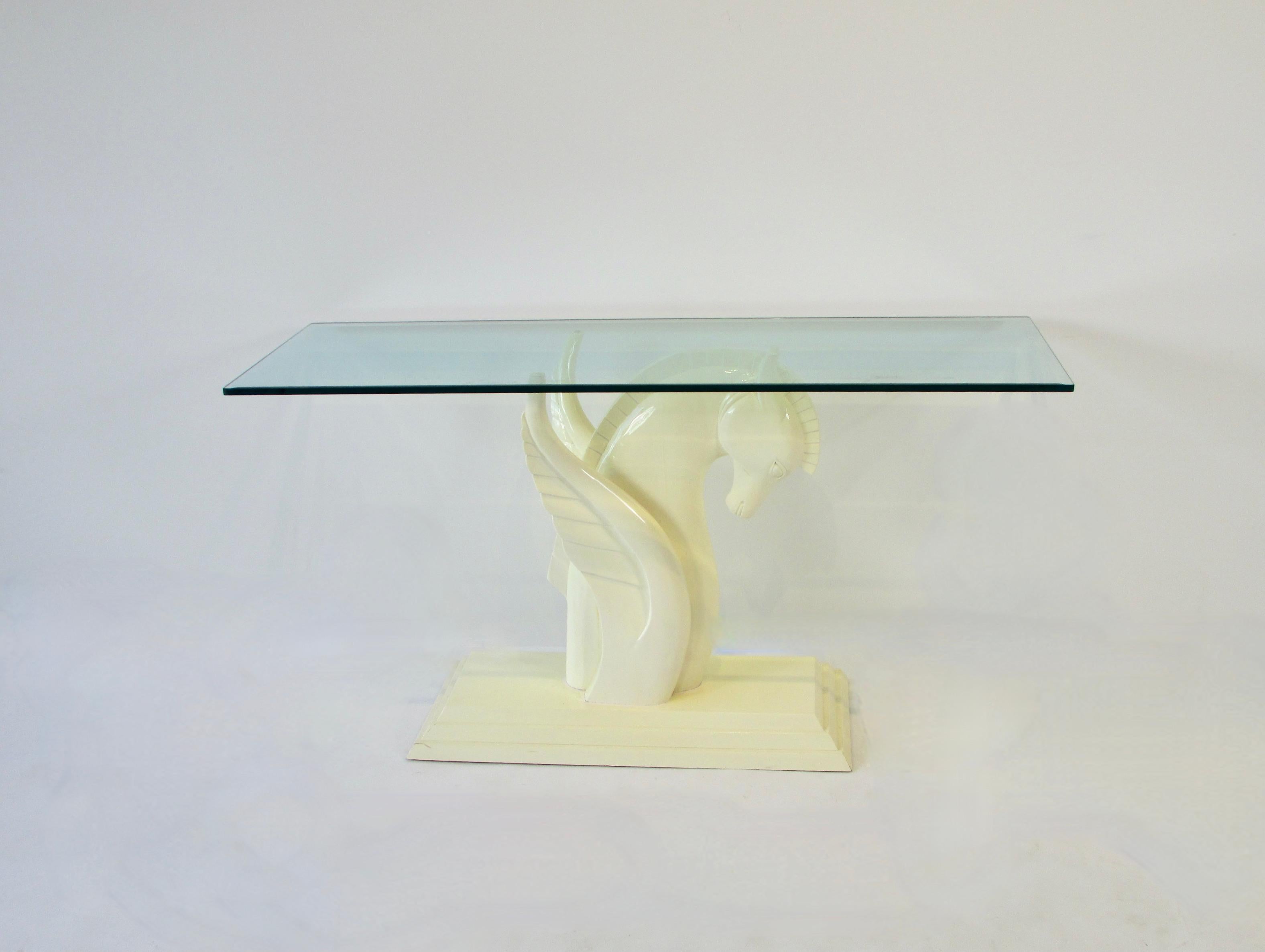 In trying to bring back the opulence of the Art Deco era designers such as Karl Marx introduced pieces like this Winged Pegasus lacquered console table. The Retro Deco console is very much in his style. Console base measures 14 deep by 32 wide at 28