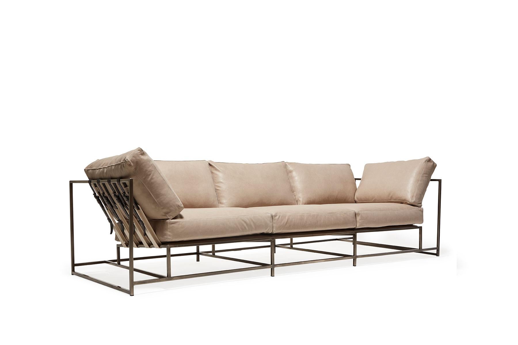 The Inheritance Sofa by Stephen Kenn is as comfortable as it is unique. The design features an exposed construction composed of three elements - a steel frame, plush upholstery, and supportive belts. The deep seating area is perfect for a relaxing