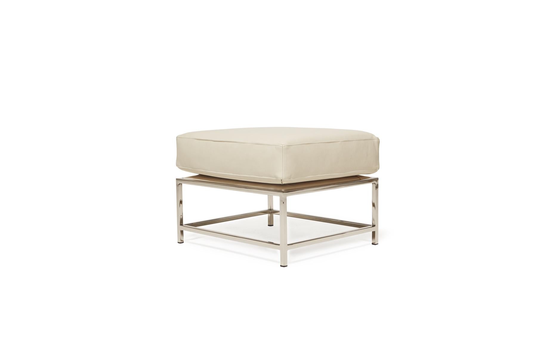 The ottoman from Stephen Kenn's Inheritance Collection is a versatile piece to add a lounge element to your seating arrangement.

This variation is upholstered in a smooth, cream-colored leather from the Valhalla Collection by Moore & Giles with a