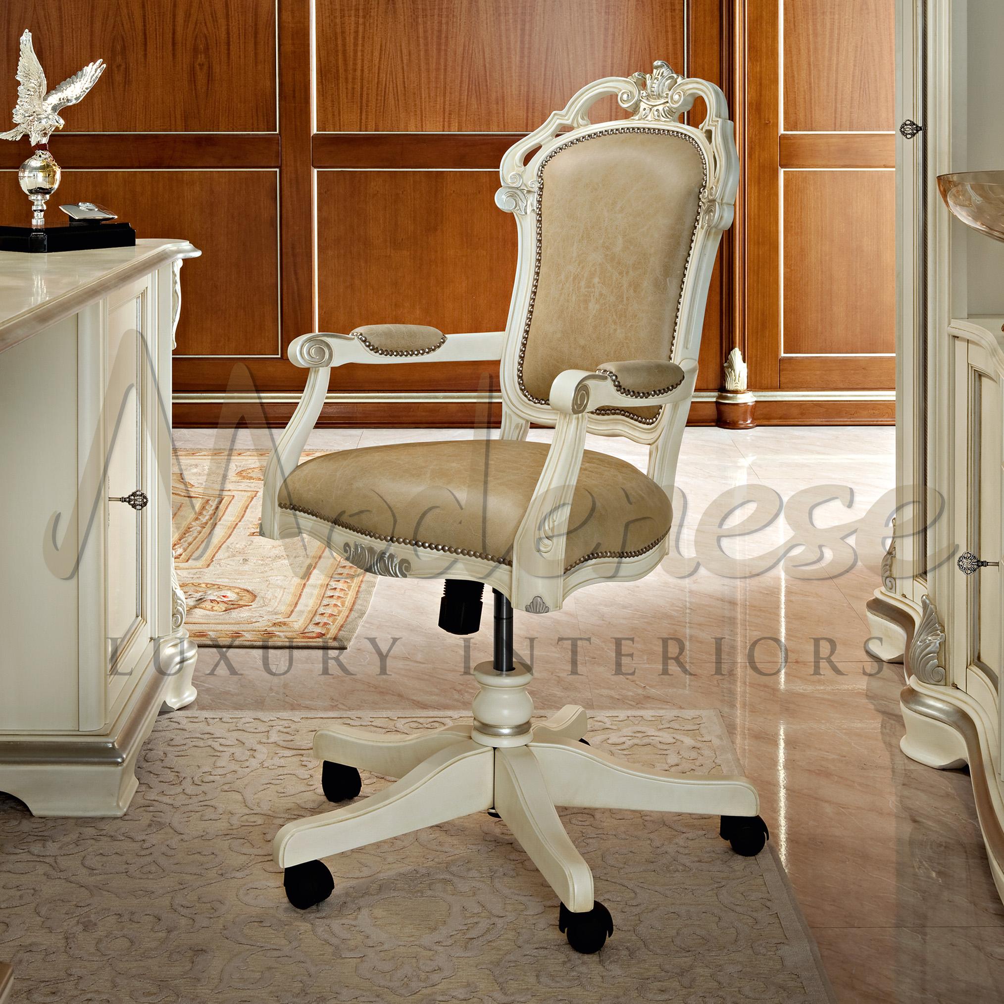 Real cream-coloured leather office swivel chair with armrest featuring ivory finishings, gold leaf details and carved decorations. Designed and produced with the best quality materials by Modenese Gastone Luxury Interiors, leader Italian homeware