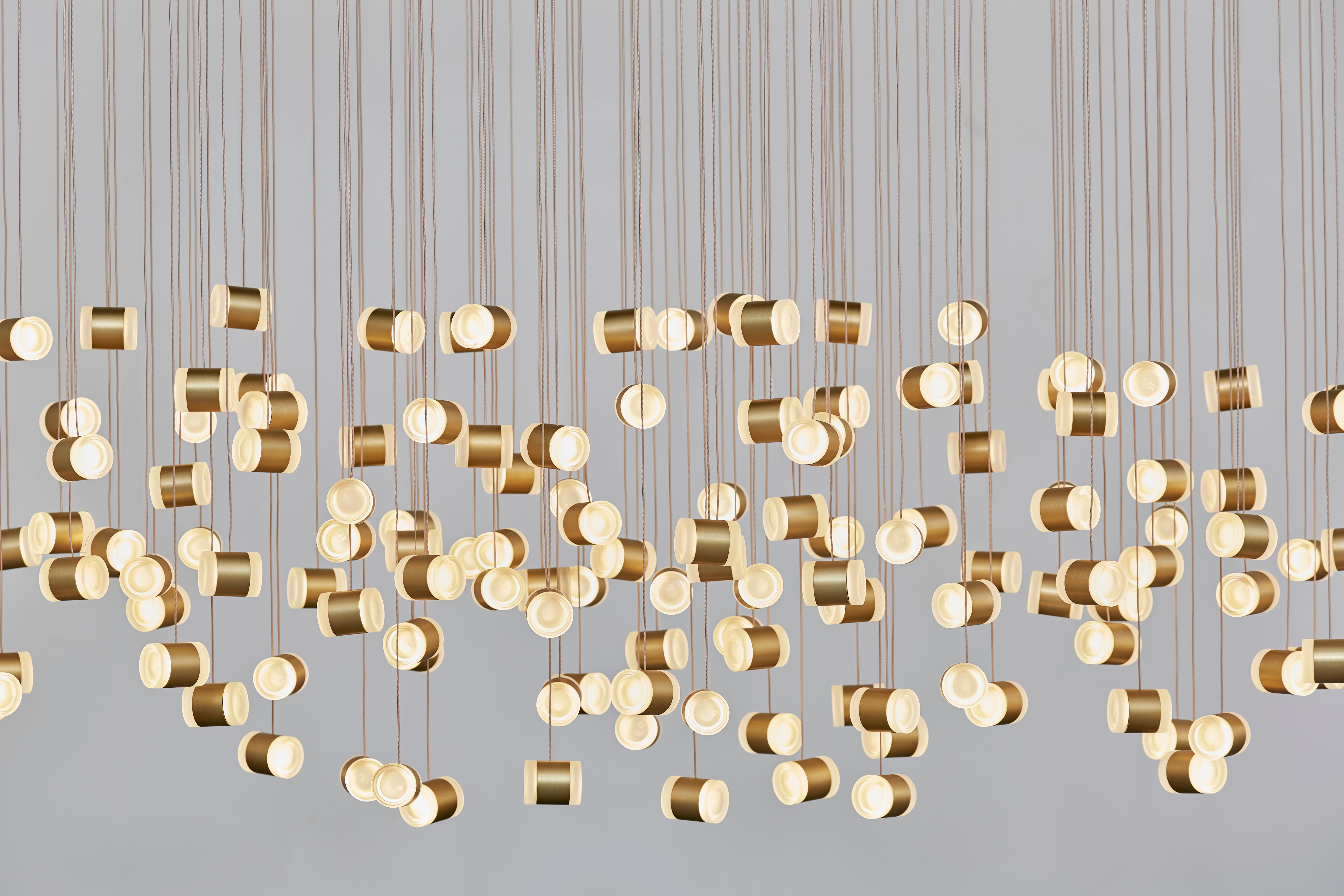 In cooperation with the German cosmetics company Cosnova beauty, this spectacular lighting installation by LLOT LLOV was created from 290 reused face cream containers. Two pots each made of high-quality frosted glass form one lighting element. Due