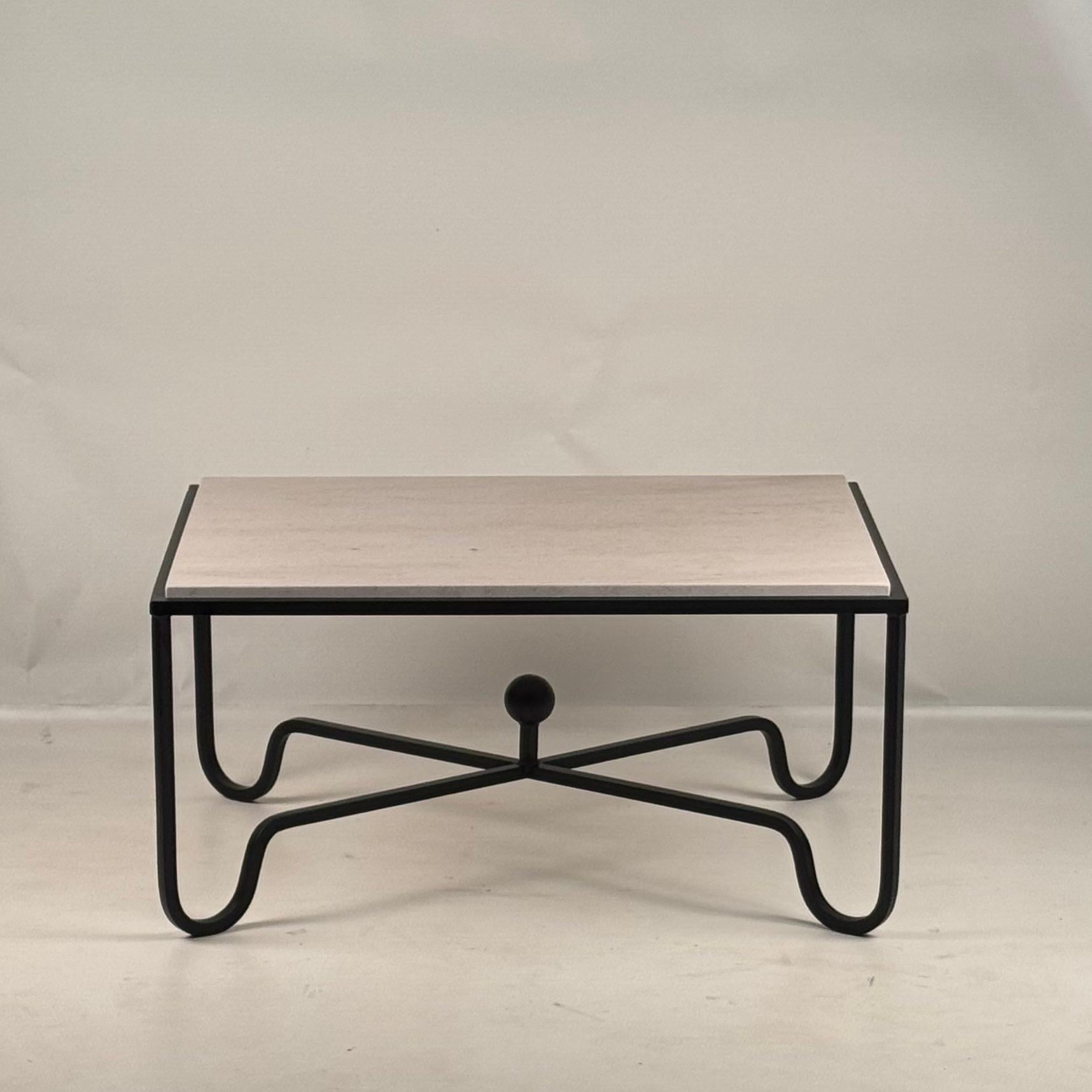 Honed cream limestone 'Entretoise' coffee table by Design Frères.
Chic and understated.