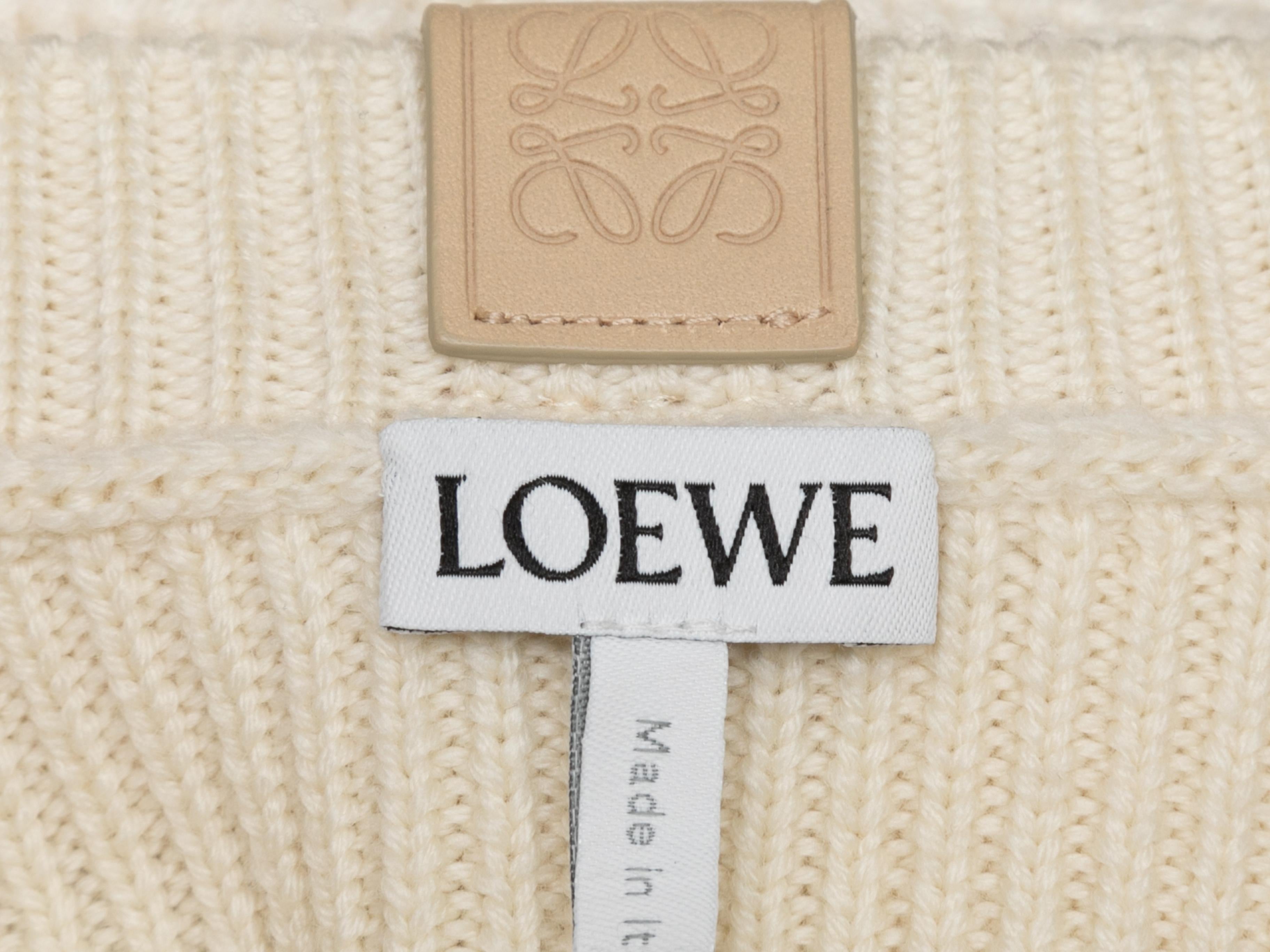 Cream rib knit wool sweater by Loewe. Crew neck. Long balloon sleeves. 30