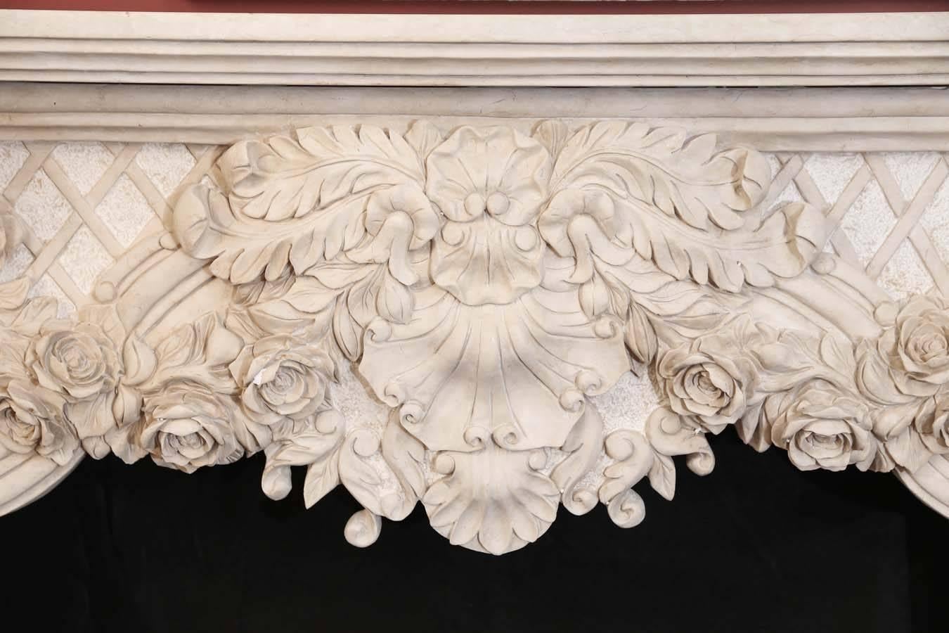 Cream marble mantel carved with flowers and foliate designs on the front
and sides in elaborate detail. This mantel would be a lovely addition to
a new home or restoration project. It is available and ready to ship.