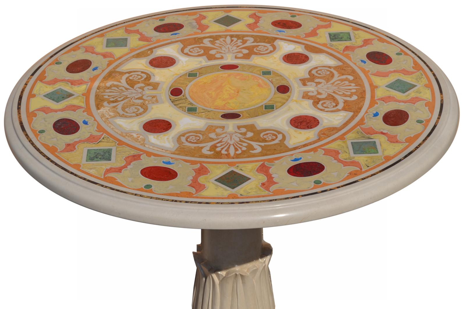Cream marble round dining table or gueridon table
size: diam. 80 cm h. 74
 inches 31.50 h. 29.13
This table has been handcrafted by skilled artist using the old technique 
of the scagliola art inlay and takes inspiration from the classical paliotto