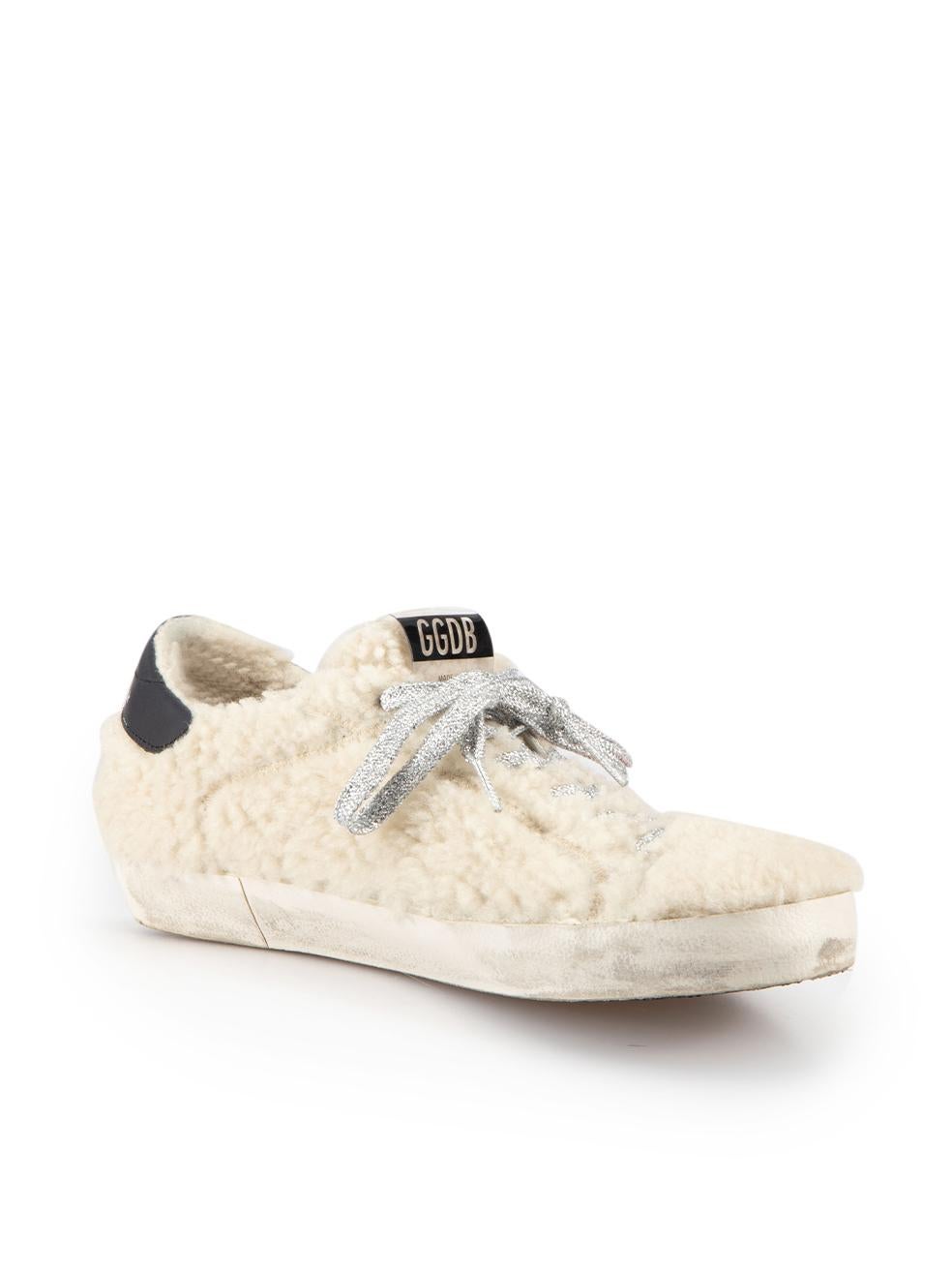 CONDITION is Good. Minor wear to trainers is evident. Light wear to the shearling of both that has darkened with wear on this used Golden Goose designer resale item. 
 
 Details
  Cream
 Shearling
 Low top trainers
 Round toe
 Flatform heel
 Silver