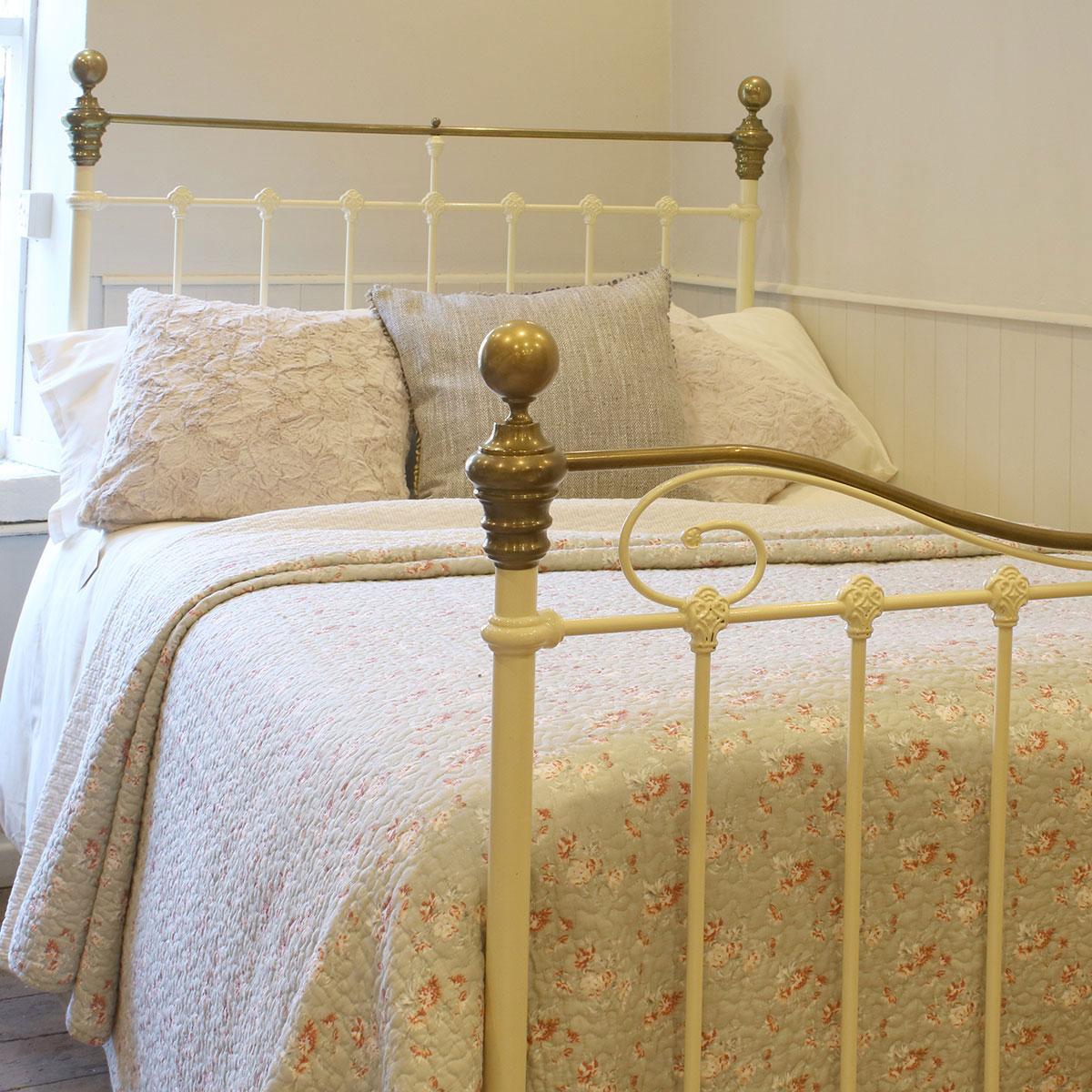 Small double late Victorian antique brass and iron bed finished in cream, with curved brass top rail and decorative scroll on the footboard. 

This bed accepts a 4ft wide (48 inch or 122cm) base and mattress.

The price is for the bed frames