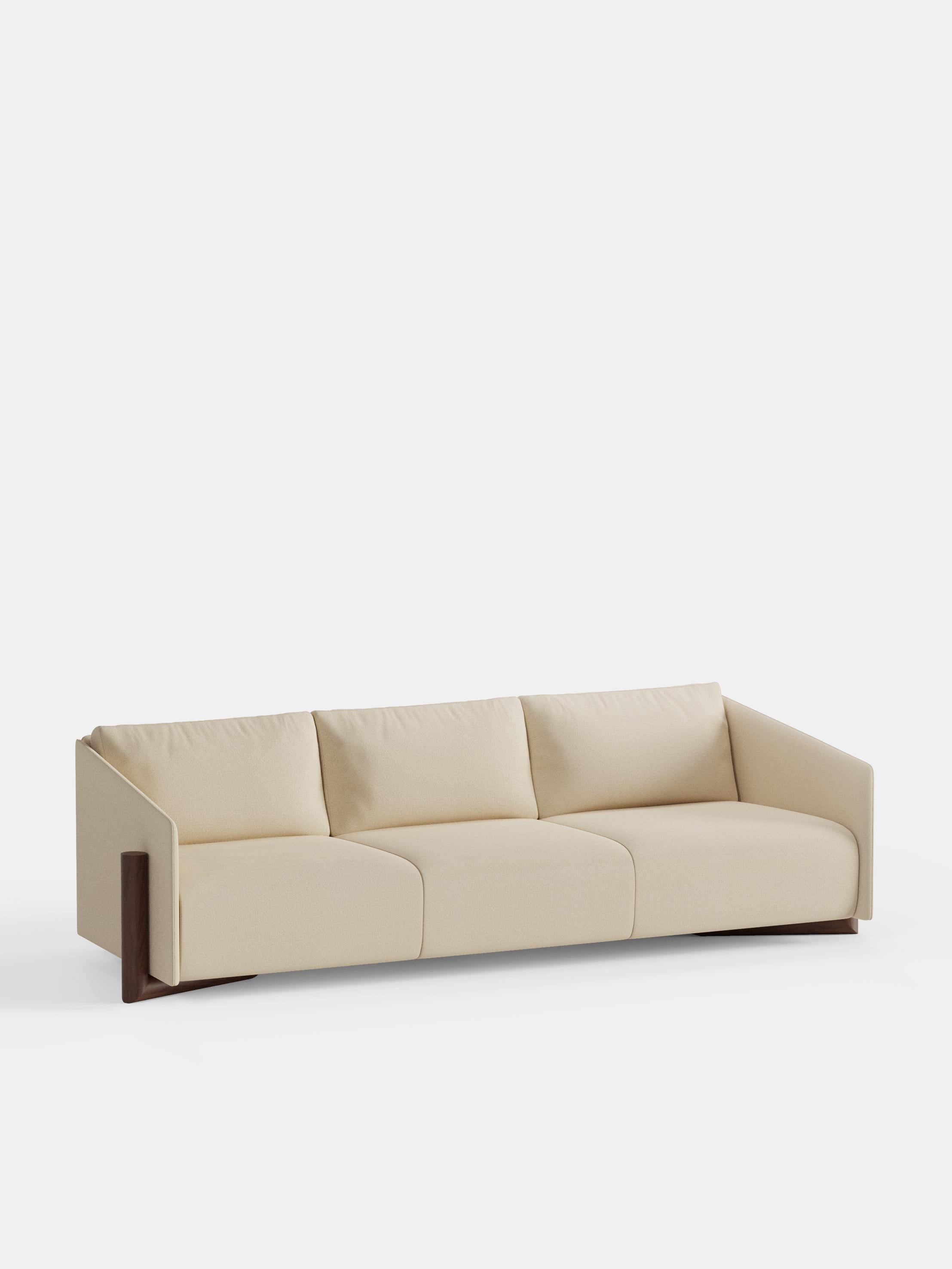 Cream Timber 4 Seater Sofa by Kann Design
Dimensions: D 104.5 x W 260 x H 75 cm.
Materials: Solid wood, elastic belts, HR foam, fabric upholstery Kvadrat Vidar 1511 (94% wool, 6% nylon).
Available in other fabrics.

The strong presence of textile in