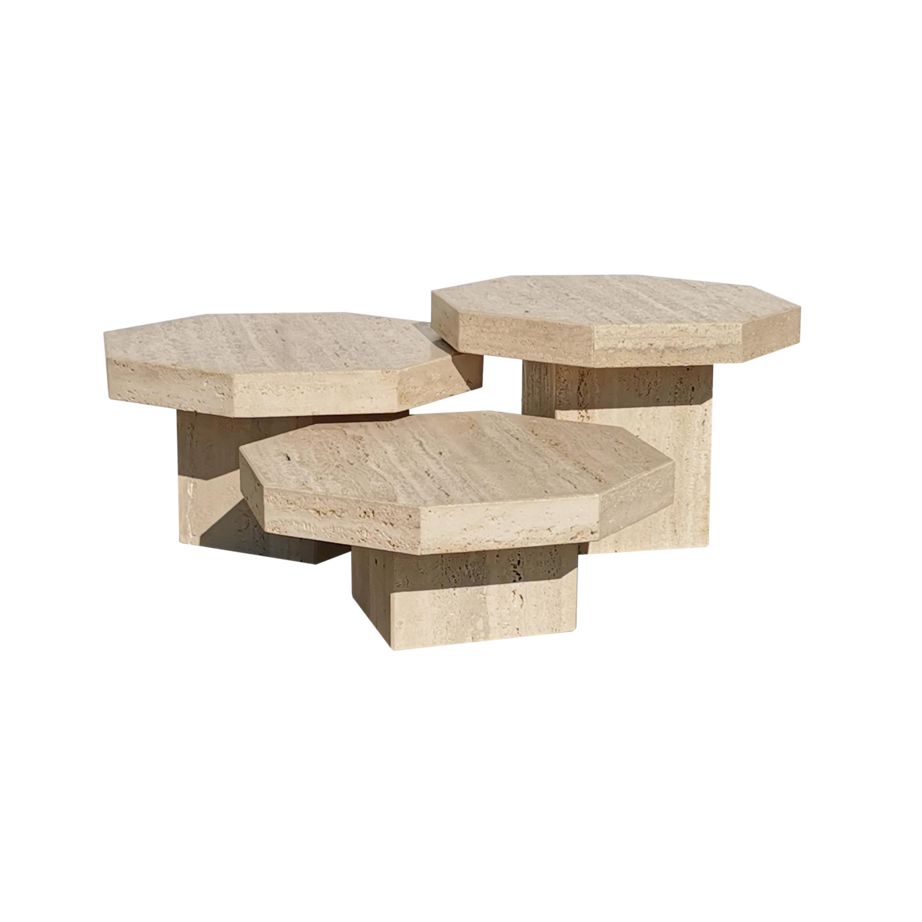 Set of three travertine coffe tables, with different heights.
Thick octagonal tops, richly grained material, raw and natural.
The stone is not bonded, keeping its brutalist appearance.
The tables have three different heights, allowing endless