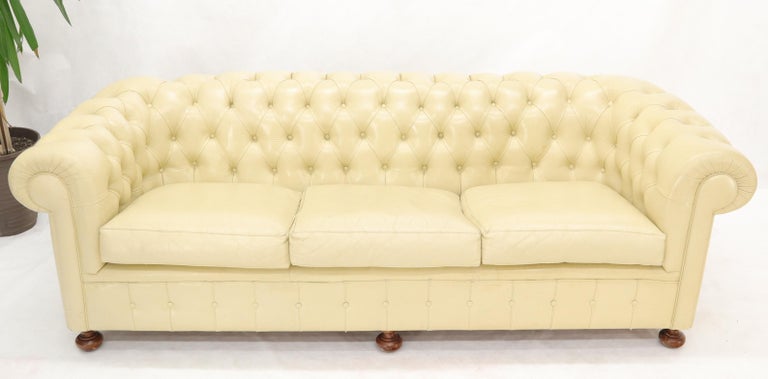 Good quality vintage cream leather Chesterfield sofa.