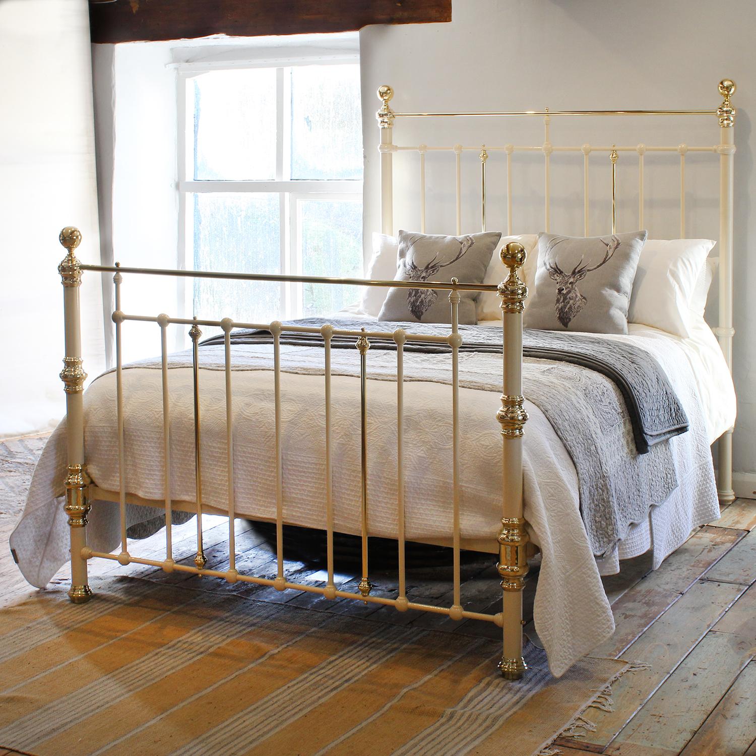 An attractive cast iron Victorian antique bed finished in cream with brass decoration.

This bed accepts a UK king size or US queen size (5ft, 60in or 150cm wide) base and mattress set.

The price includes a standard firm bed base to support the