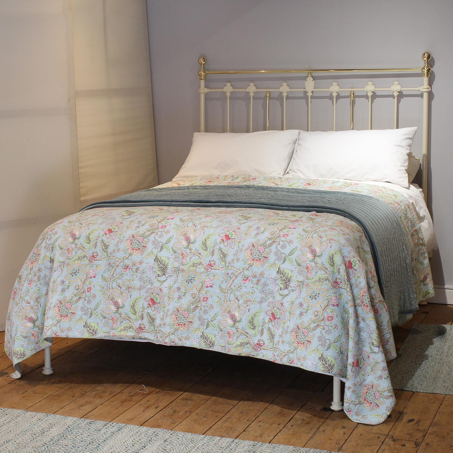 An attractive cast iron Victorian antique platform bed with low foot end, finished in cream with brass decoration.

This bed accepts a UK king size or US queen size (5ft, 60in or 150cm wide) base and mattress set.

The price includes a standard firm