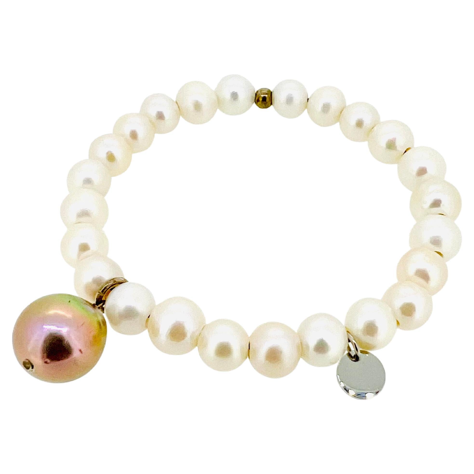 Cream White Freshwater pearl bracelet with dangling lustrous pink baroque pearl