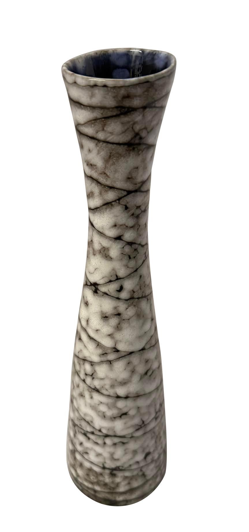 1940's Hungarian Brutalist design brown and cream thin shaped vase.
Dark brown lines crisscross from top to bottom.
Signature cobalt blue interior glaze.
Part of a large collection.