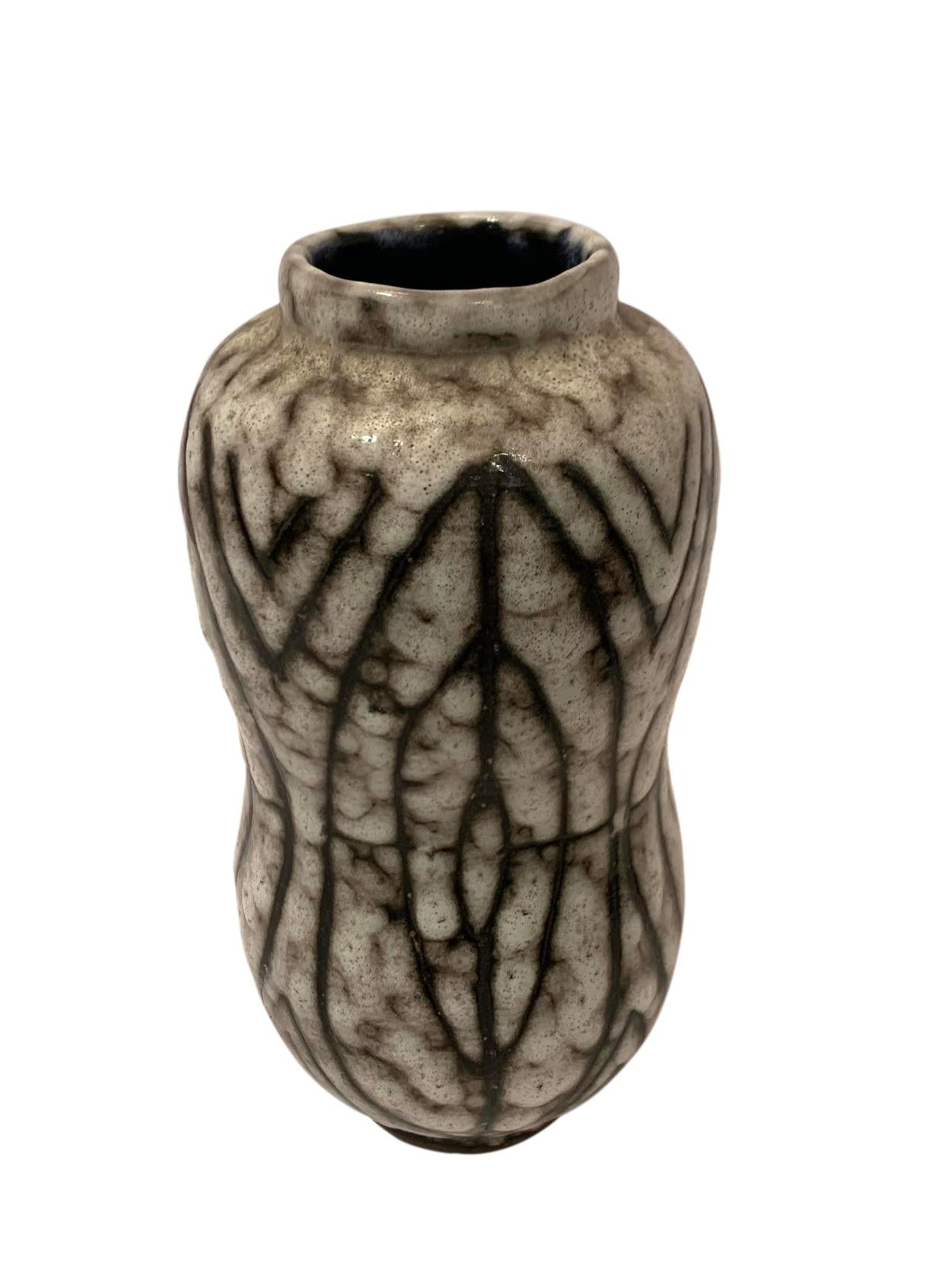 1940's Hungarian cream ground with thin vertical oval shaped circular pattern design vase.
Slightly textured glaze.
Can hold water.
From a large collection.
