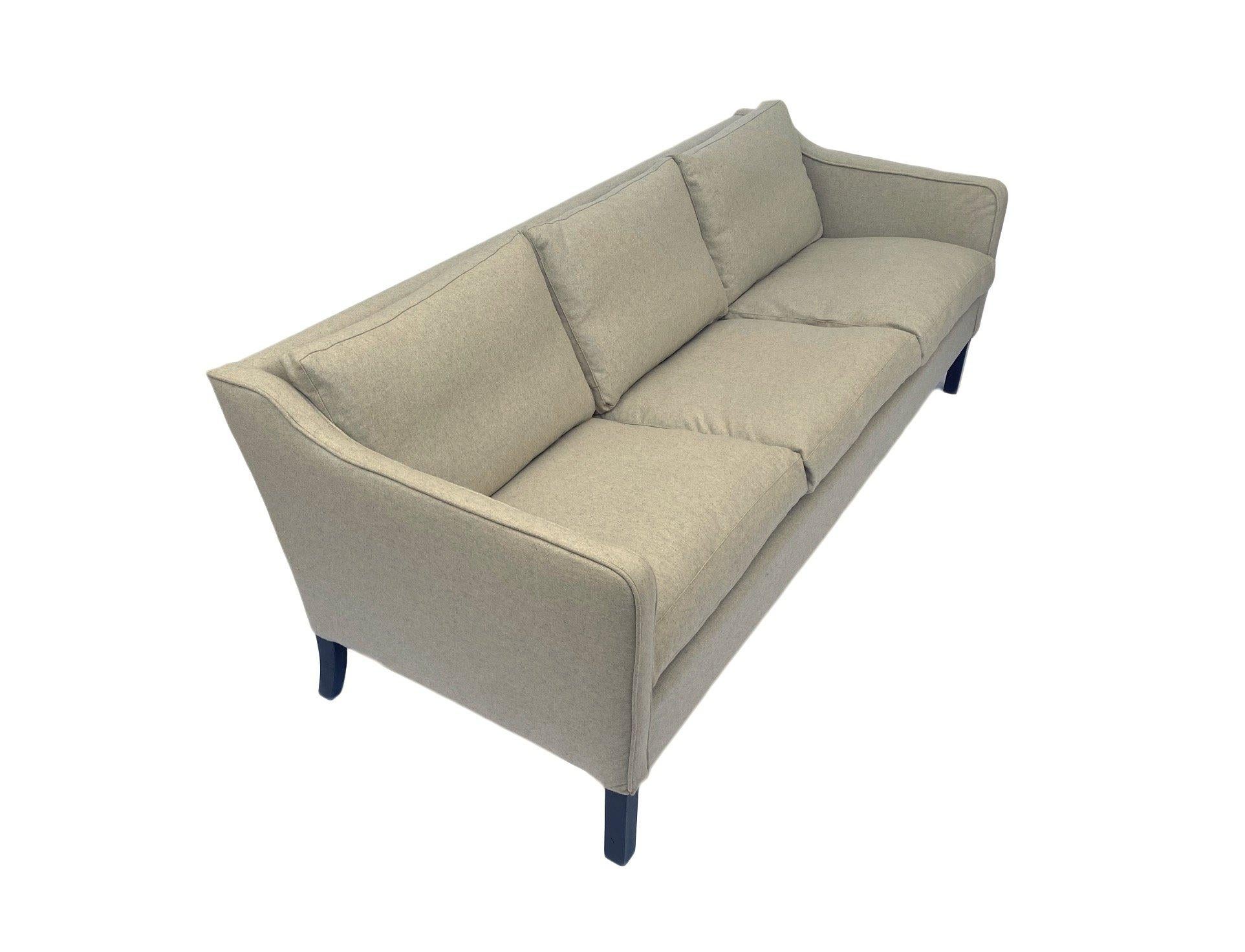 A beautiful Danish cream wool 3 seater sofa, this would make a stylish addition to any living or work area.

The sofa has a padded armrests and feather cushions for enhanced comfort. A striking piece of classic Scandinavian furniture.

The sofa