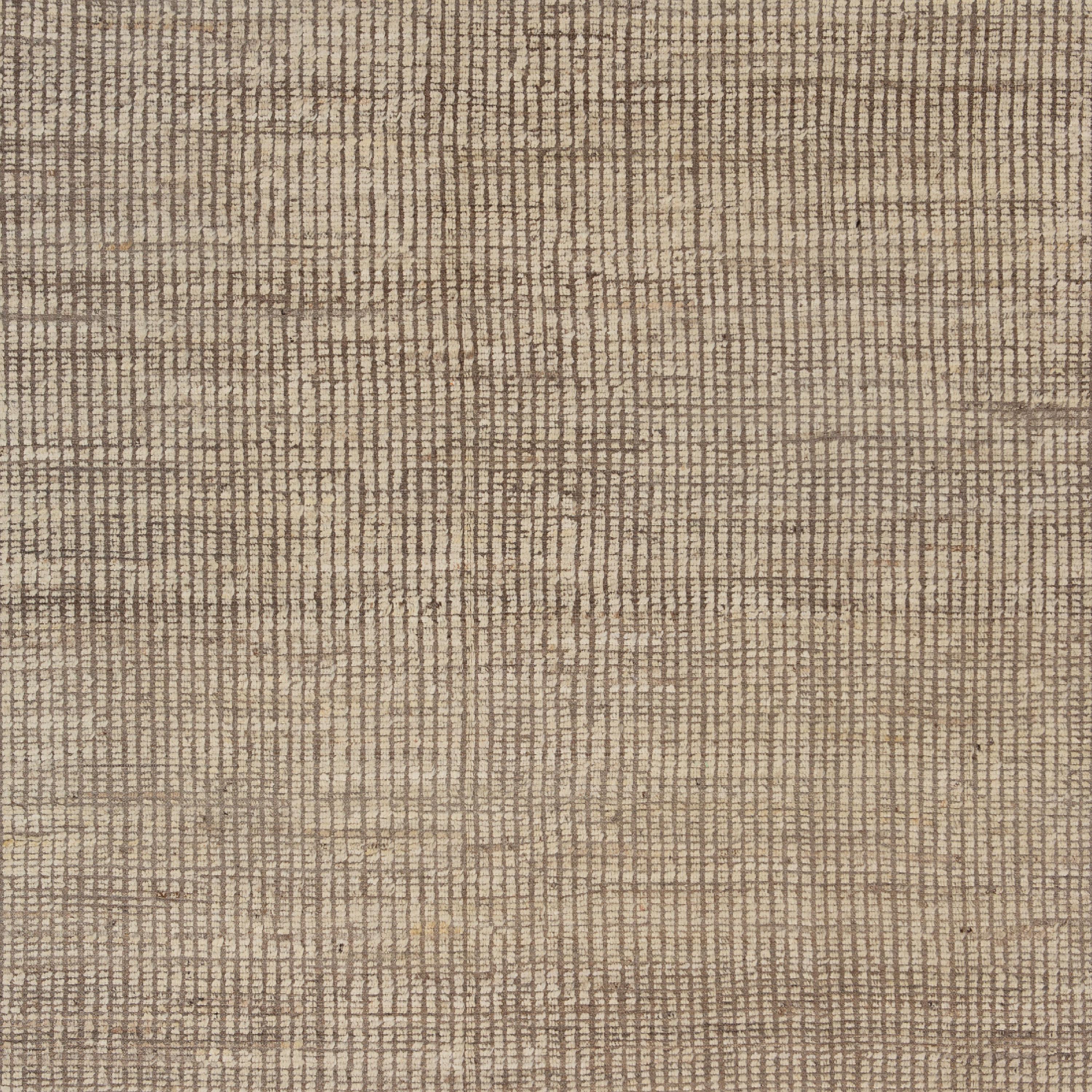 Inspired by the grounding foundations of Earth's natural colors and pure materials, this Zameen Beige Solid Modern Wool Rug - 6'11