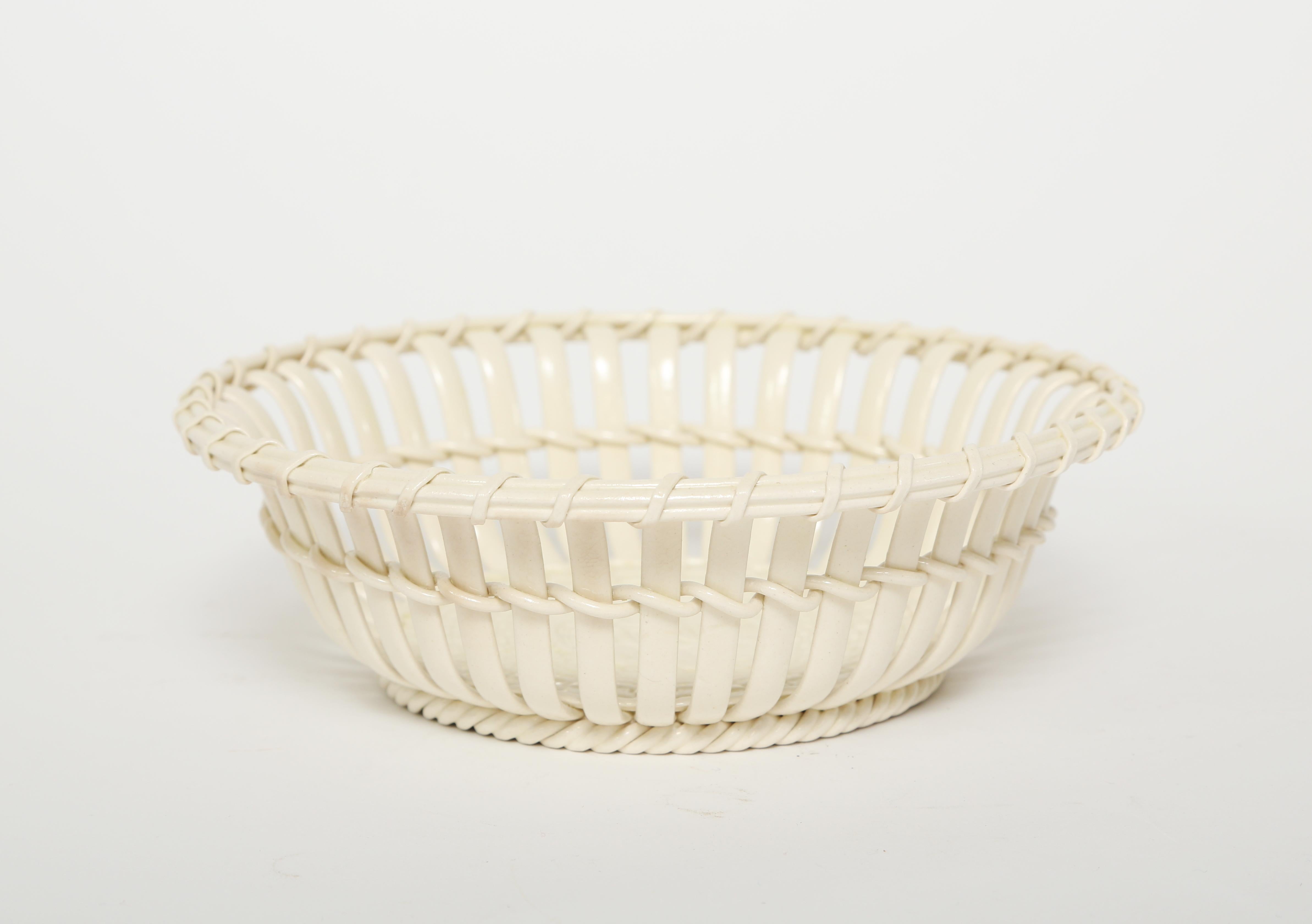 Antique Wedgwood creamware chestnut basket in very good condition.  This basket for today's use would be great filled with cherries, strawberries or grapes.  There are no chips or cracks.
Diameter 7.25