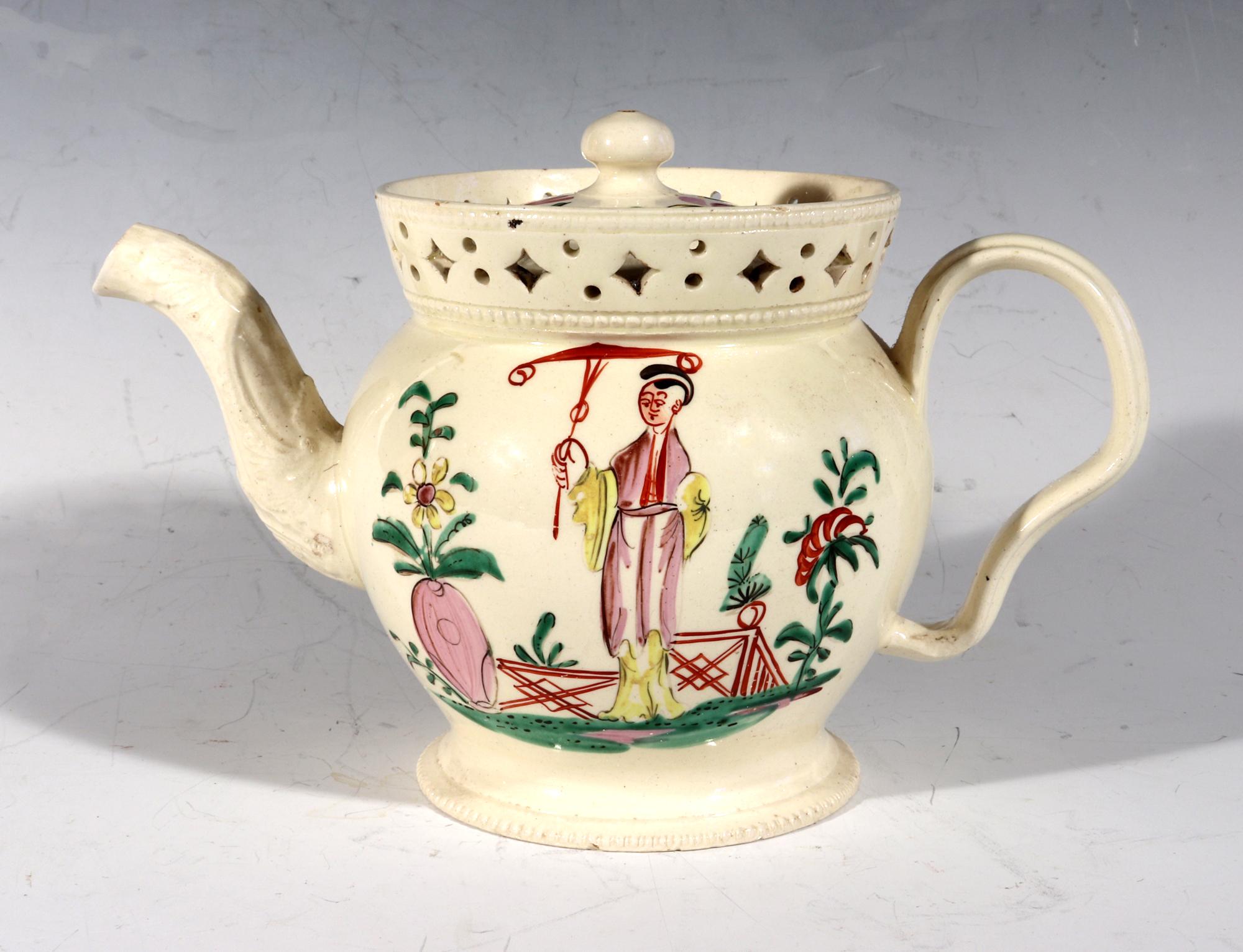 English creamware Chinoiserie teapot & cover with pierced galleried rim.
Circa 1775.

The circular English creamware teapot with two designs front and back. The front has a Chinoiserie painting of a Chinese lady with parasol in a garden setting