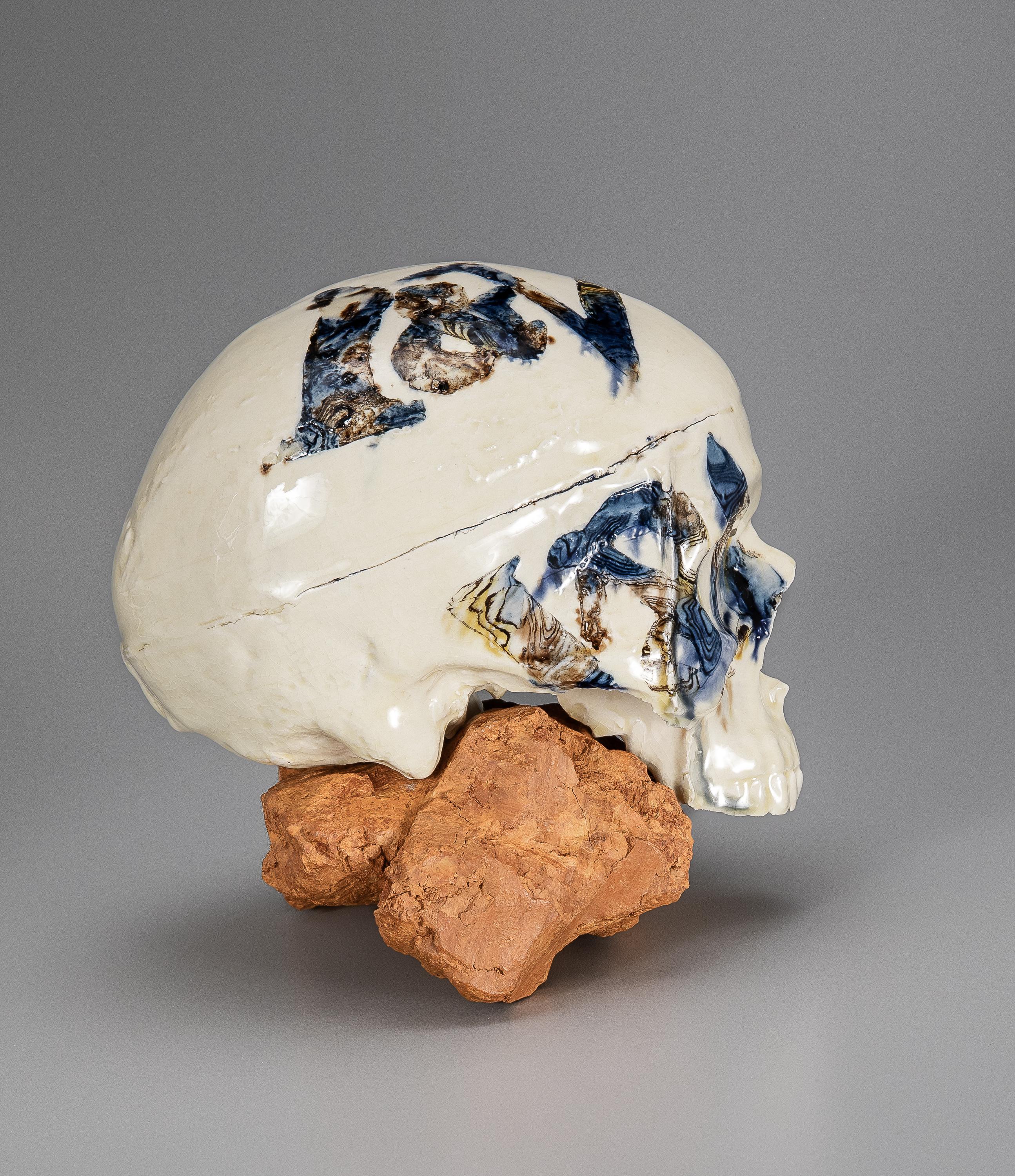 CREAMWARE SKULL 2012 V&A Residency as World Class Maker
H 7”
Press molded and slipcast creamware with metallic oxide agate and indigenous London clay.

Description
	This skull incorporates Erickson’s experimental archeology in recreating an 18th