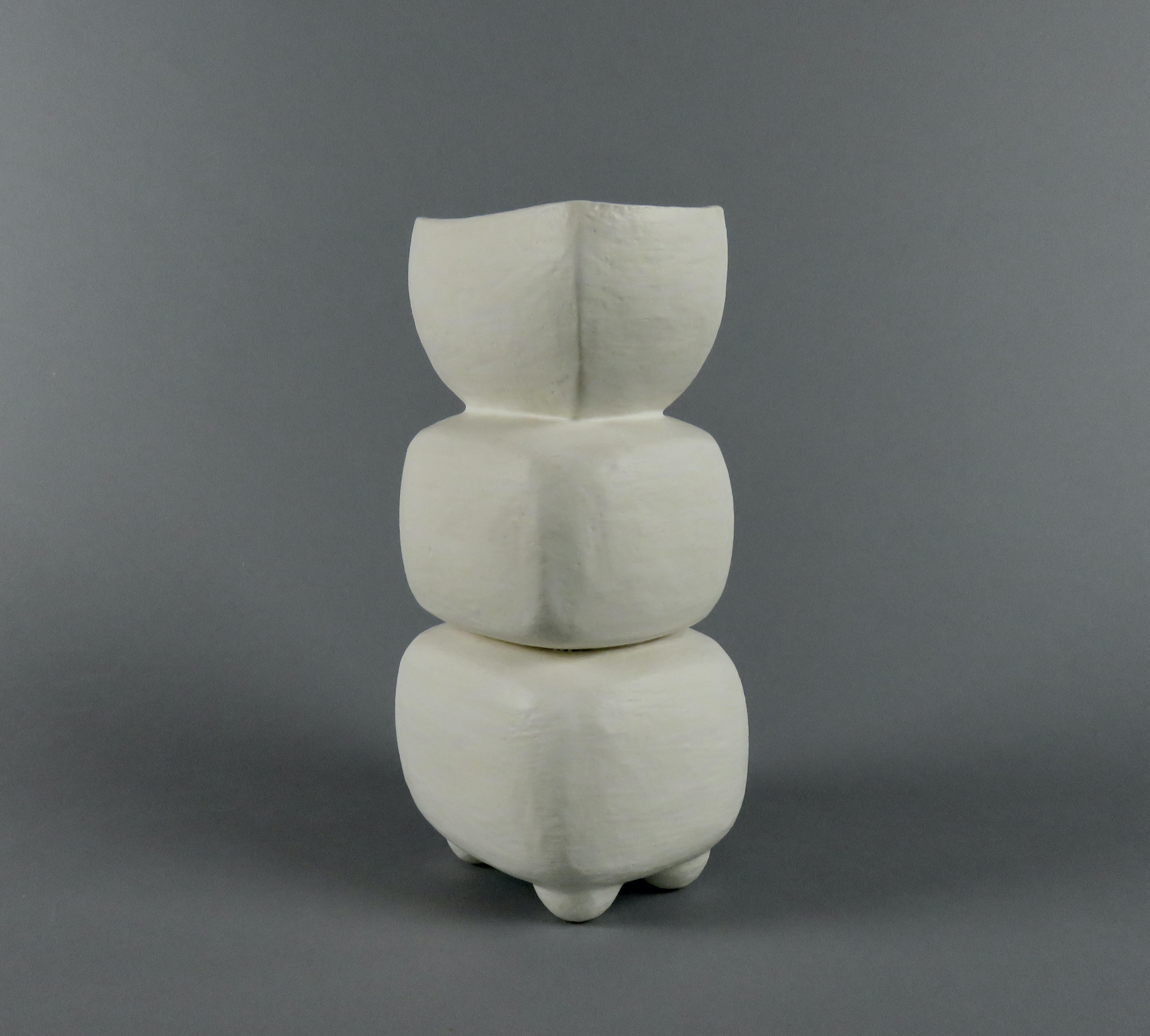 This luscious, creamy, almost waxy off-white surface is the combination of 2 glazes. One in a series of Modern TOTEMS, there are 3 parts, including a rectangular cup form on top. The stacked parts are made separately then combined, and the always