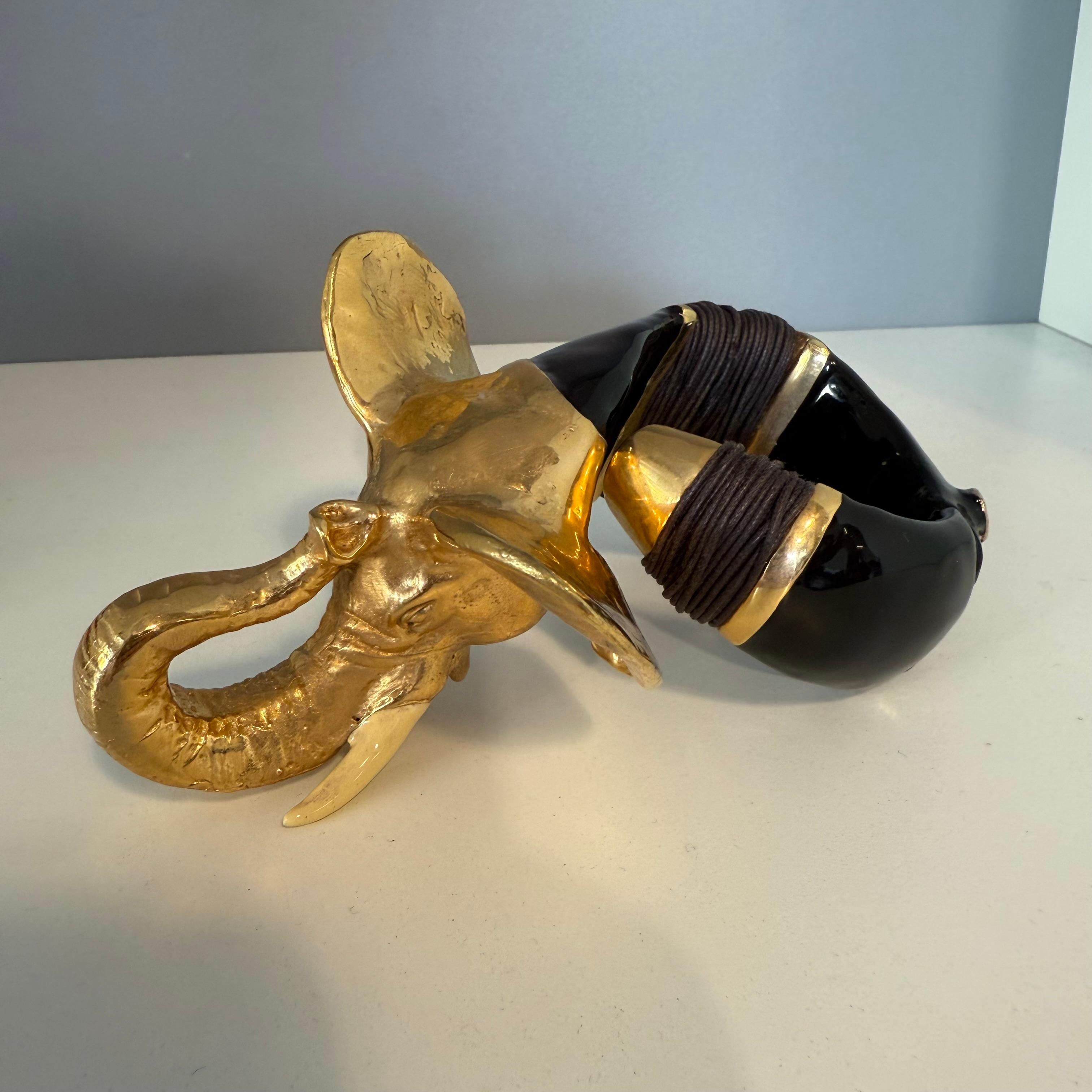 Amazing, rare and funny bangle by Creart
Made in Italy
Golden metal
Enamelled
Black color
Elephant
Wrist cm 17 approximately (6,69 inches)
Worldwide express shipping included in the price !

 