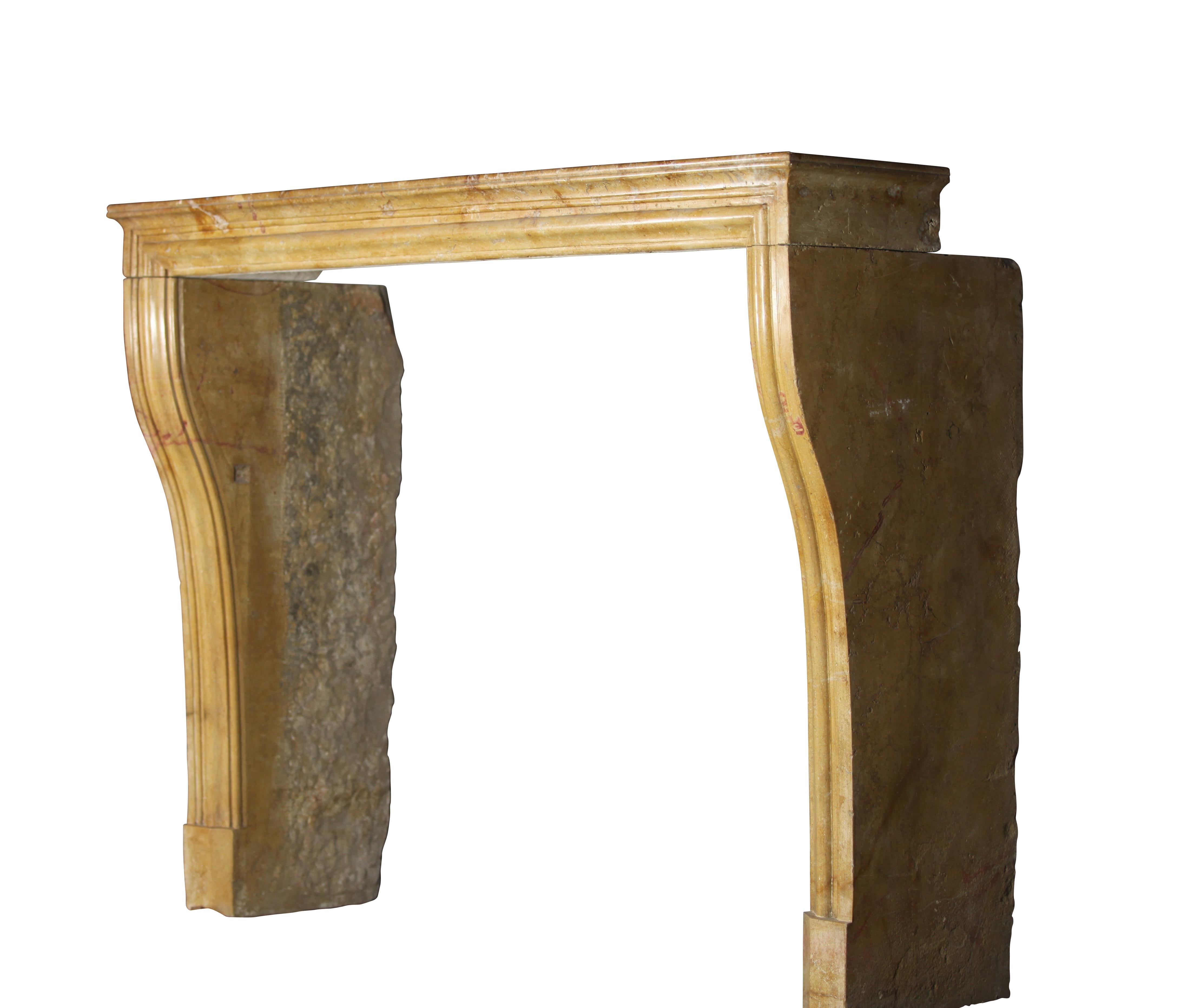This is a nicely waxed original French antique fireplace surround in a Louis XIV style of the 19th century. The hard stone/marble has red and honey color veining and from the village Corton. Corton is a small village near Medieval city of