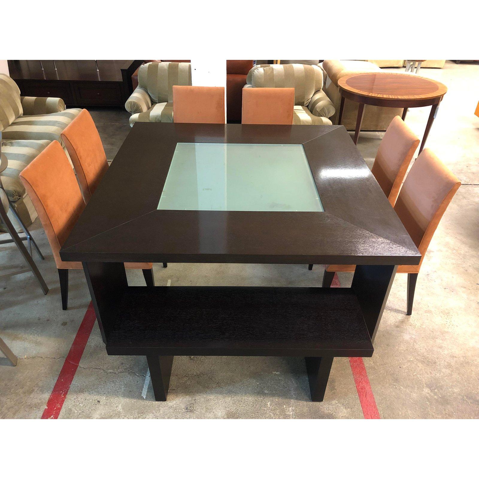 A dining set by Creative Elegance. A set from the Visions Collection. A square wood table in a dark chocolate finish with a Frost glass center insert. Accompanied with a set of six Ceylon chairs is a Aztec Ultrasuede fabric. Minor wear on fabric and
