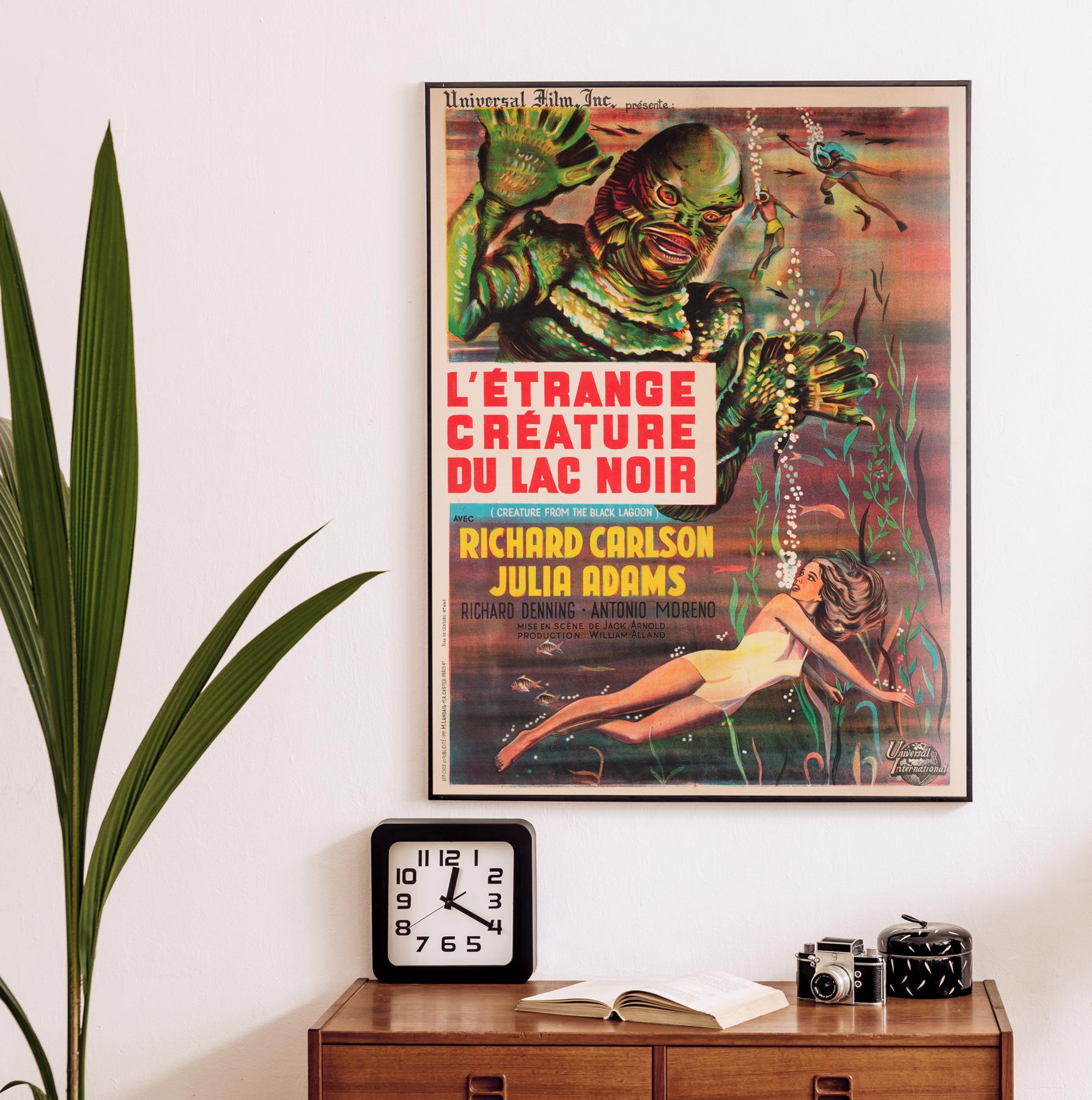 An early 60s re-release French film poster for the 1954 American classic monster movie Creature from the Black Lagoon. The film's plot follows a group of scientists who encounter a piscine amphibious humanoid in the waters of the Amazon.

Fantastic