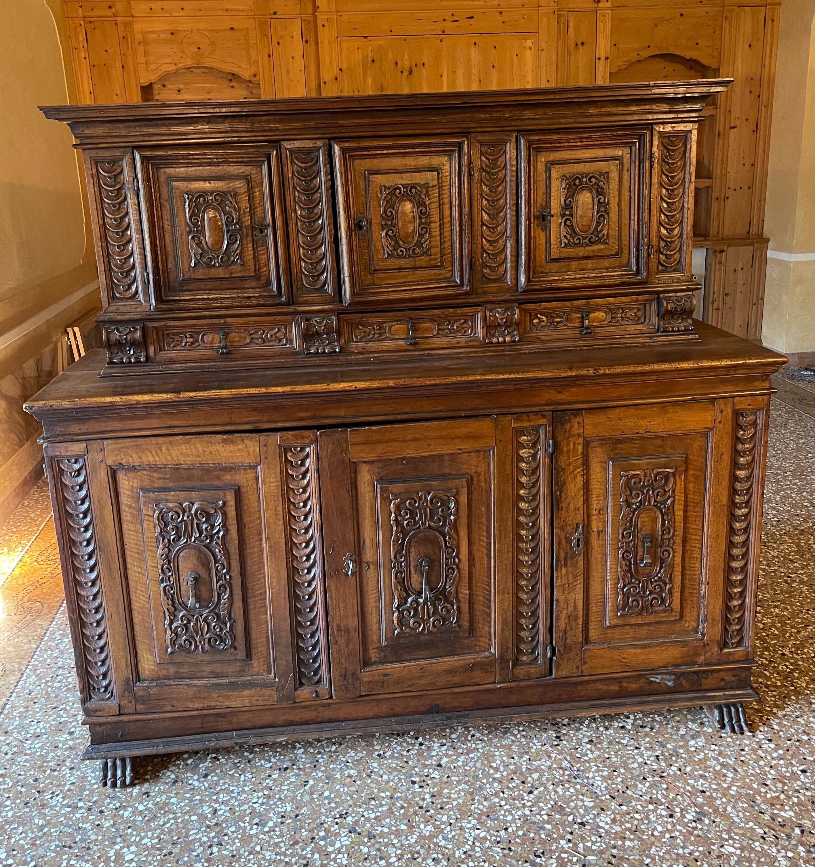 A double-bodied walnut sideboard made in the late 16th century, about 1580, in Tuscany.
During in Renaissance, monumental forms and cut decoration were favored for furnishings. Typical of this period are lion's paw-shaped cabinet 