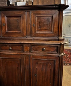 An 18th-century two-part walnut sideboard.