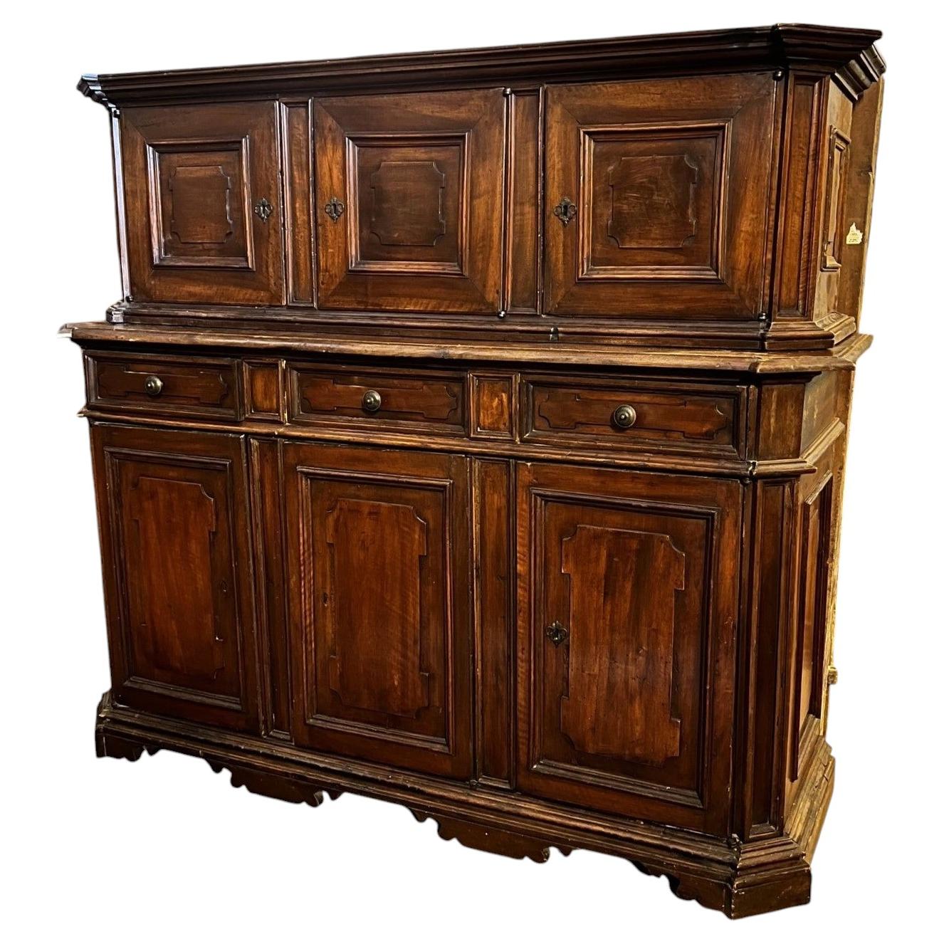 An 18th-century two-part walnut sideboard.