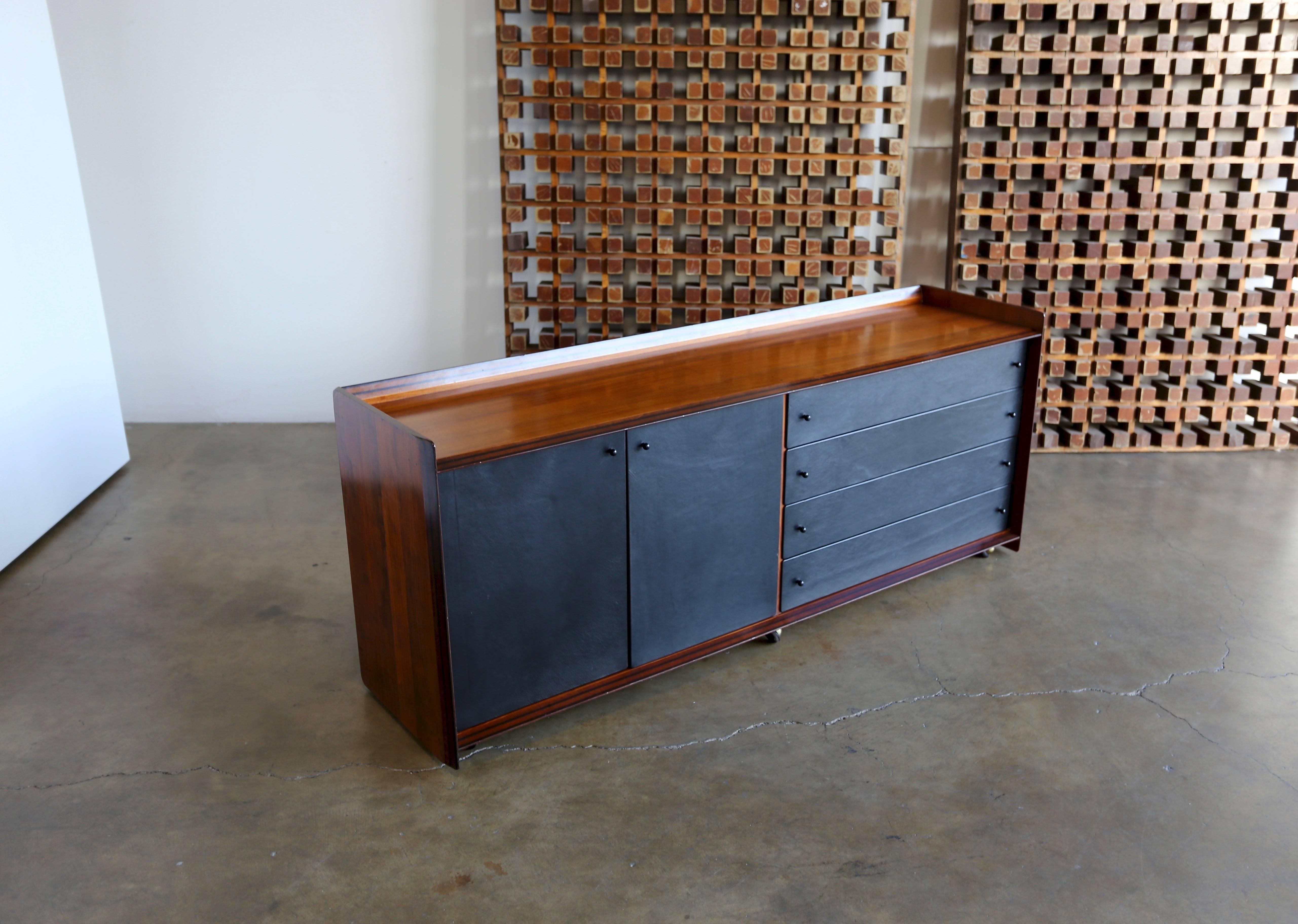 Credenza by Afra & Tobia Scarpa for Maxalto. Rosewood with black leather with a finished back.