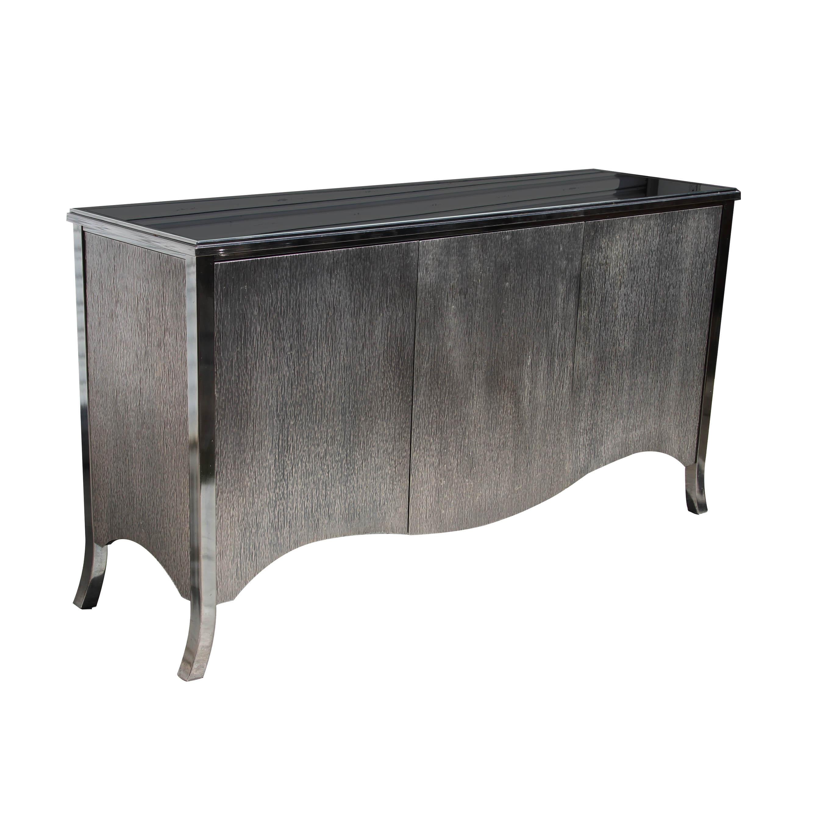 Design Institute America
2000s

Stunning three-door buffet has an inset black glass top and adjustable height interior shelves. The door fronts and sides are clad in heavy-gauge embossed steel. 


Overall dimensions: Width: 63 inches, Height: 35