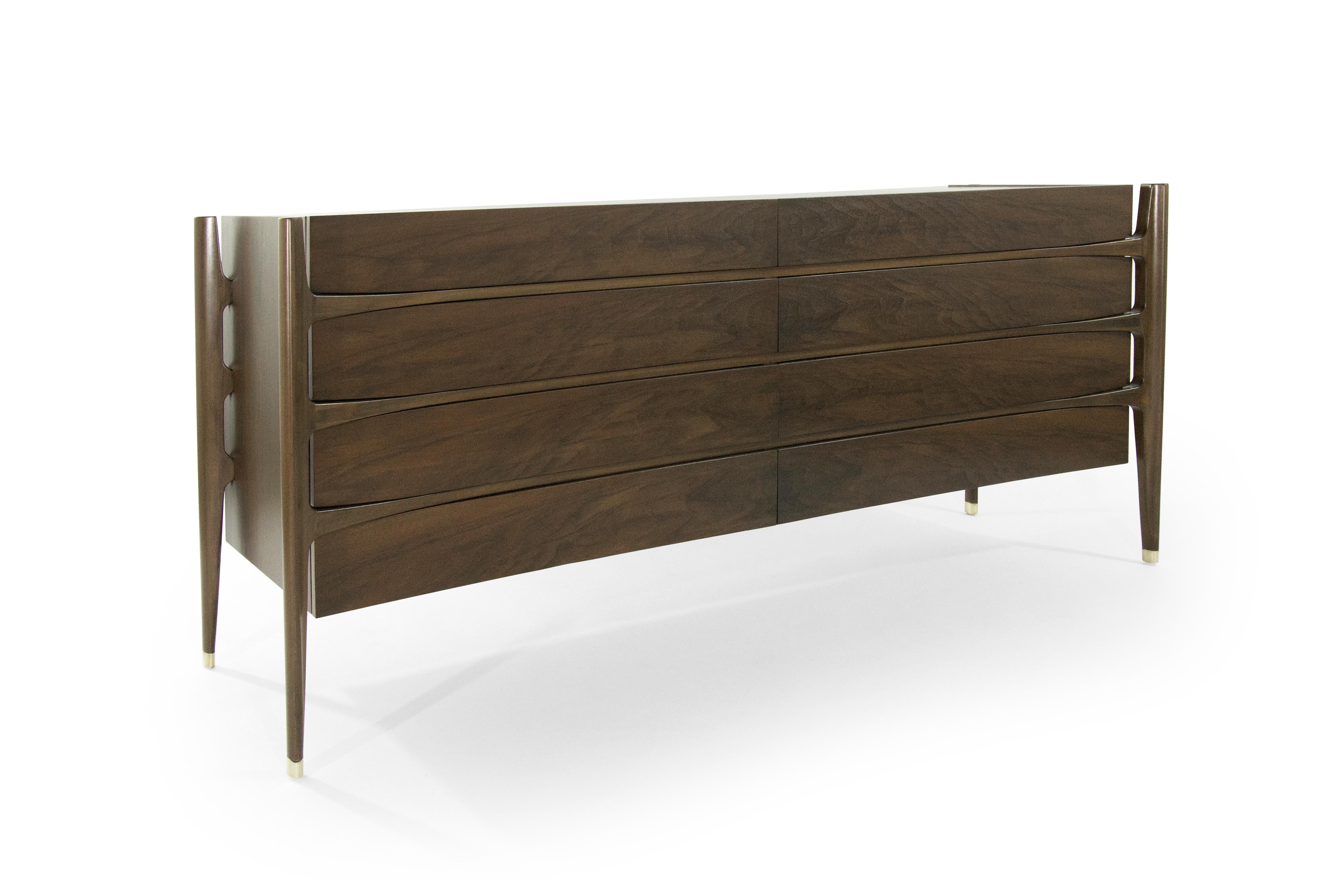 Extremely rare credenza in rosewood designed by Jorgen Clausen for Brande Møbelfabrik, circa 1950s. Fully restored.
Often misattributed to Edmond Spence. This particular piece features bookmatched drawers, exterior framing and brass sabots.