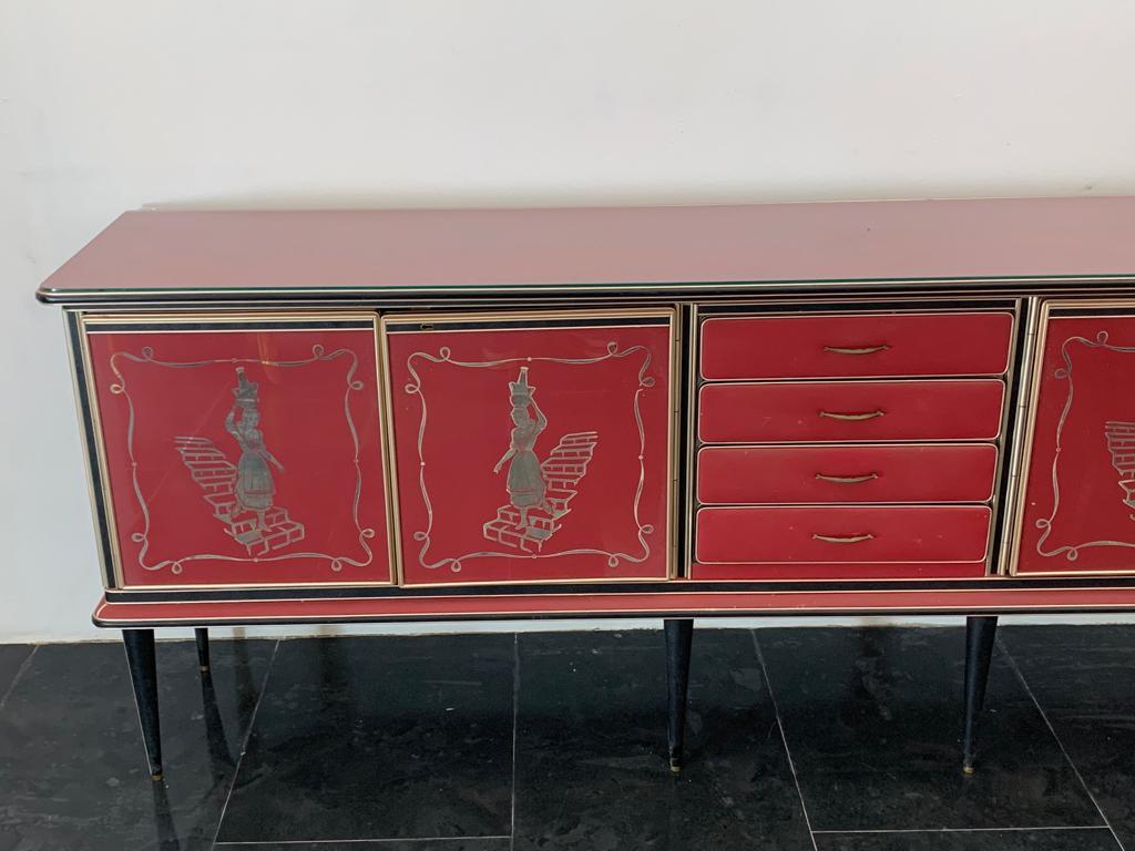 Sideboard by Umberto Mascagni, 1950s. Splendid burgundy-colored leatherette upholstery, black leatherette legs and details, gilt metal borders; all excellently preserved and uniform, with no haloing or brightening of time. It features four doors