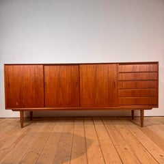 Danish teak sideboard with sliding doors and drawers, 1960s