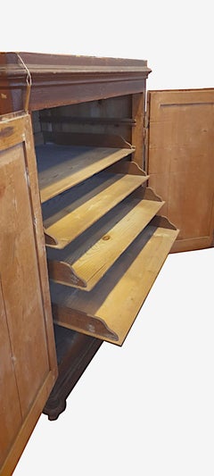 Spruce sideboard from the late 1800s with sliding interior shelves